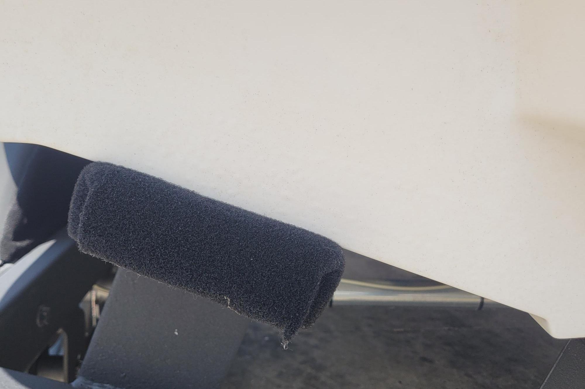 Close-up of a 2024 Tahoe 1950 boat with a black foam bumper.