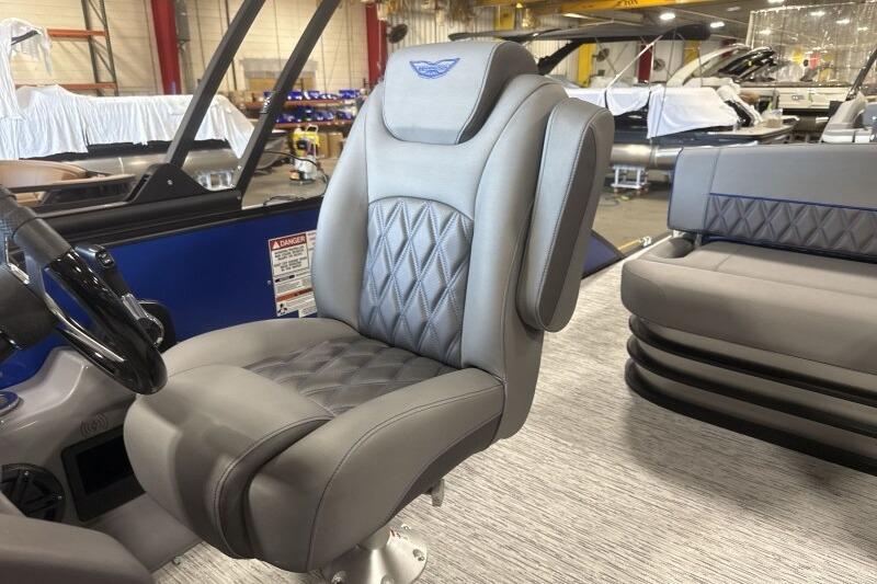 Luxurious seating on 2026 Bennington 23 LXS Swingback pontoon boat, featuring diamond-stitched upholstery.