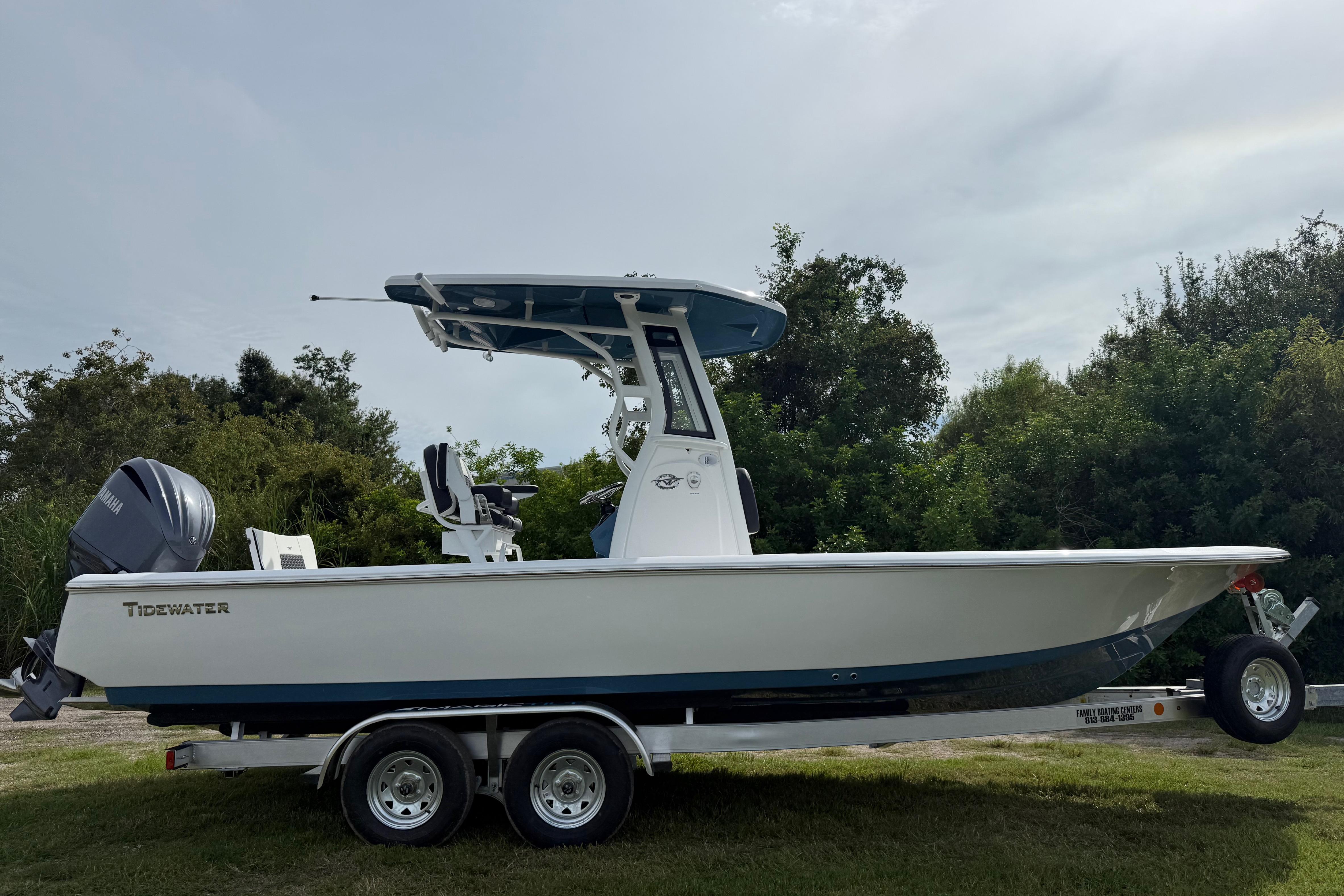 2026 Tidewater 2410 Bay Max boat on trailer, side view, outdoors.