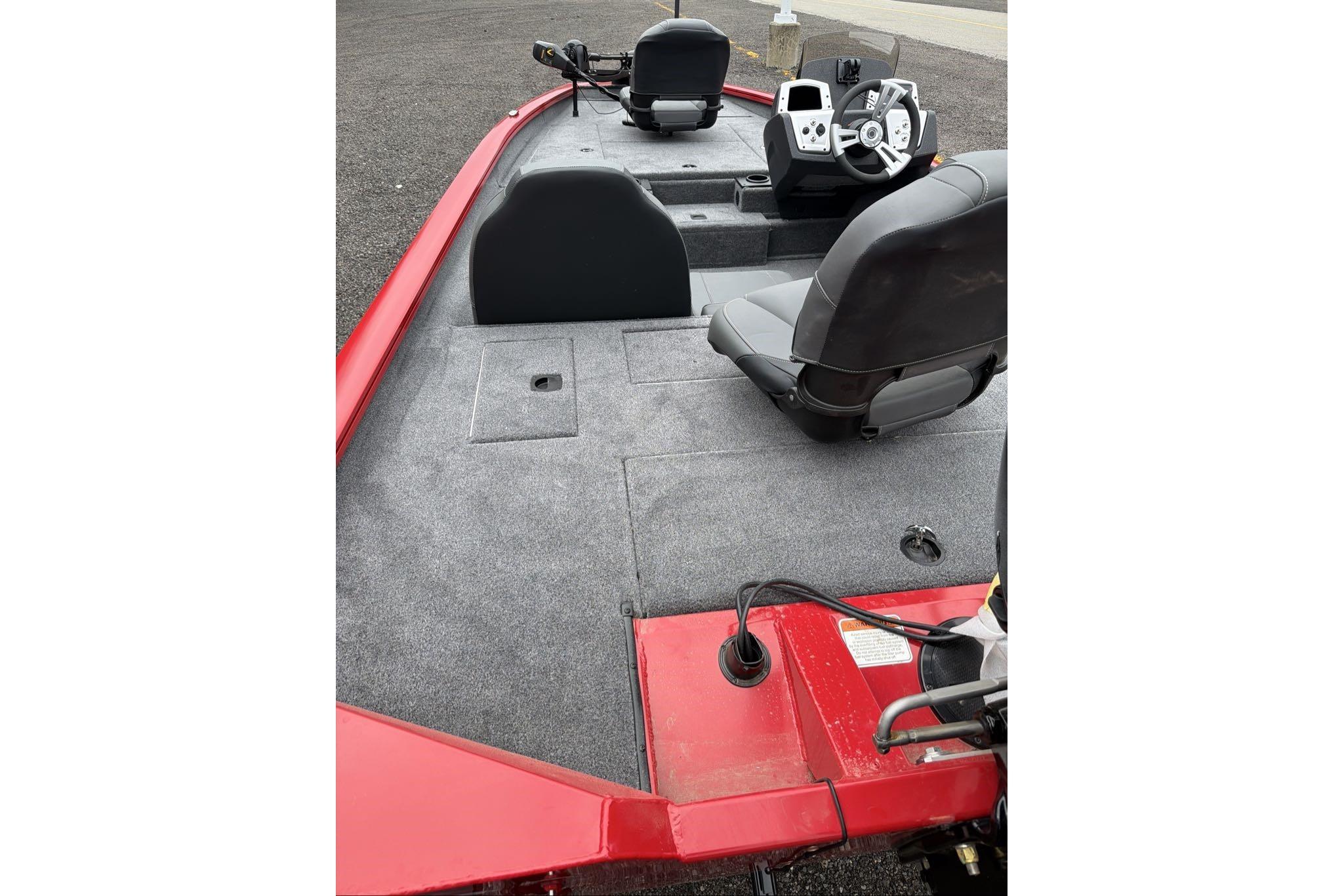 2026 Tracker Pro Team 175 boat interior with gray carpet and dual seating.