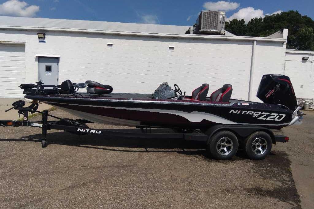 2026 Nitro Z20 XL Pro bass boat on trailer, parked outside a white building.
