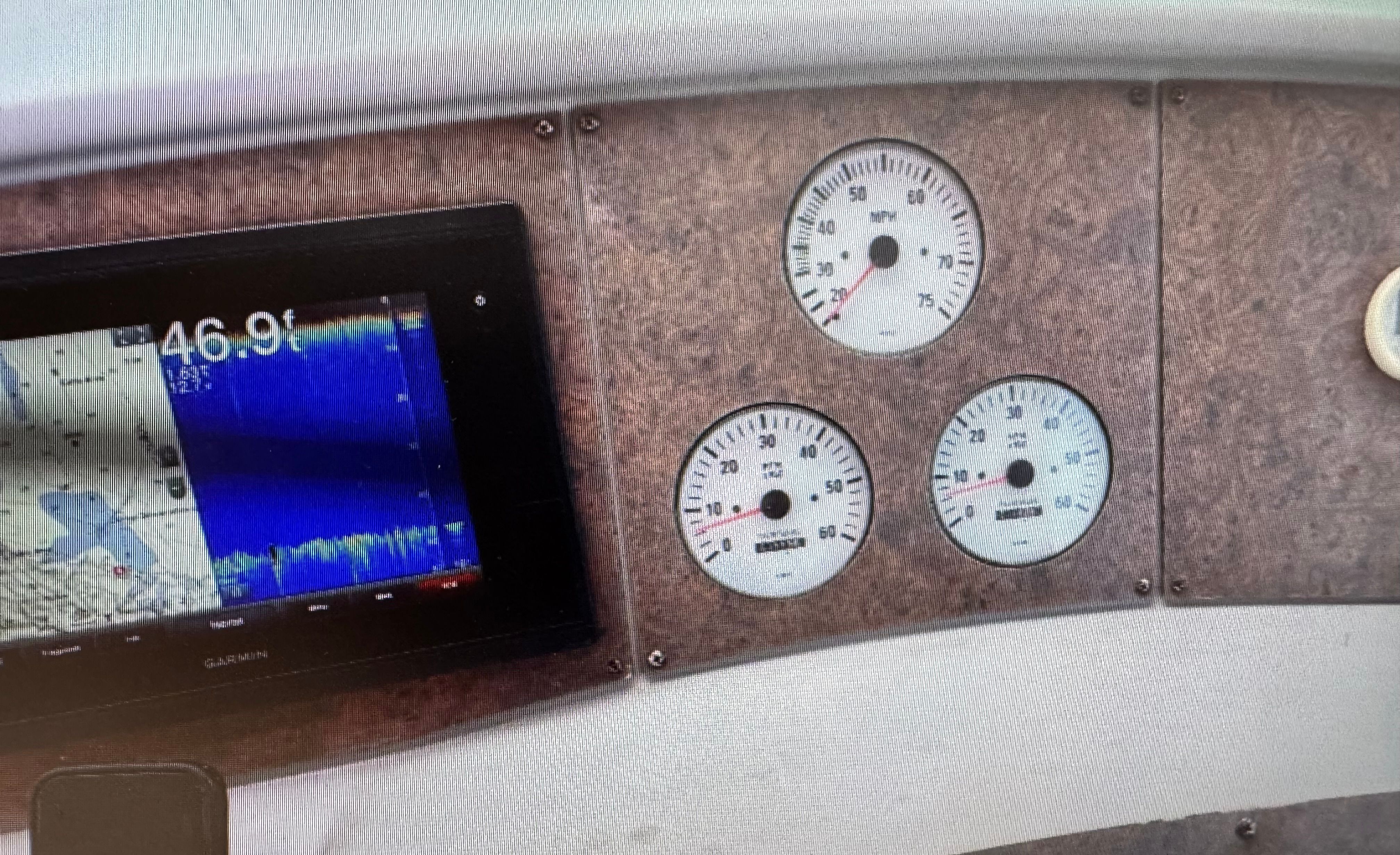 Dashboard of a 2001 Formula 37 SUPER SPORT boat with Garmin display.