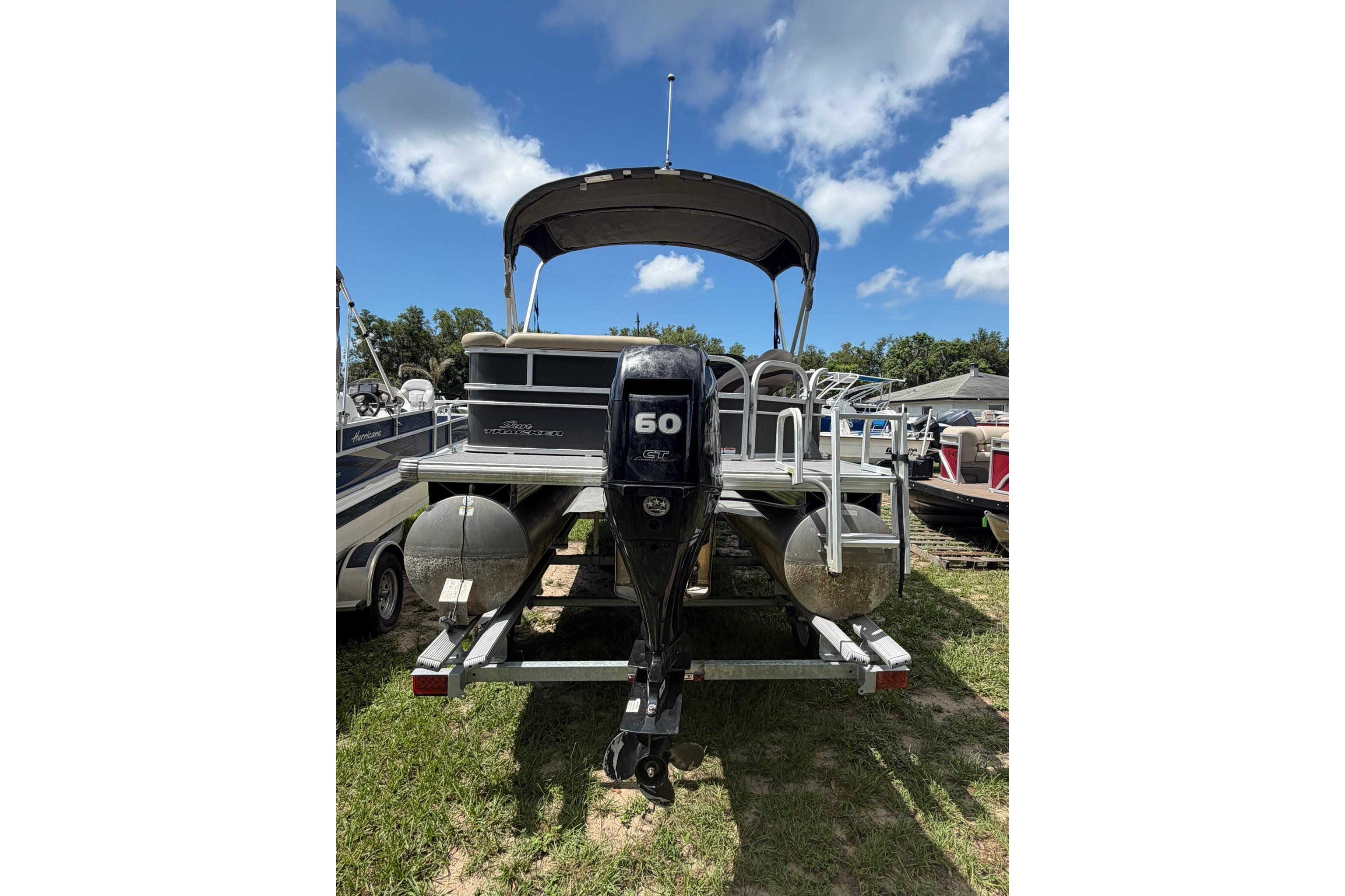 2016 SUNTRACKER Party Barge 20 pontoon boat with 60 HP engine on trailer.