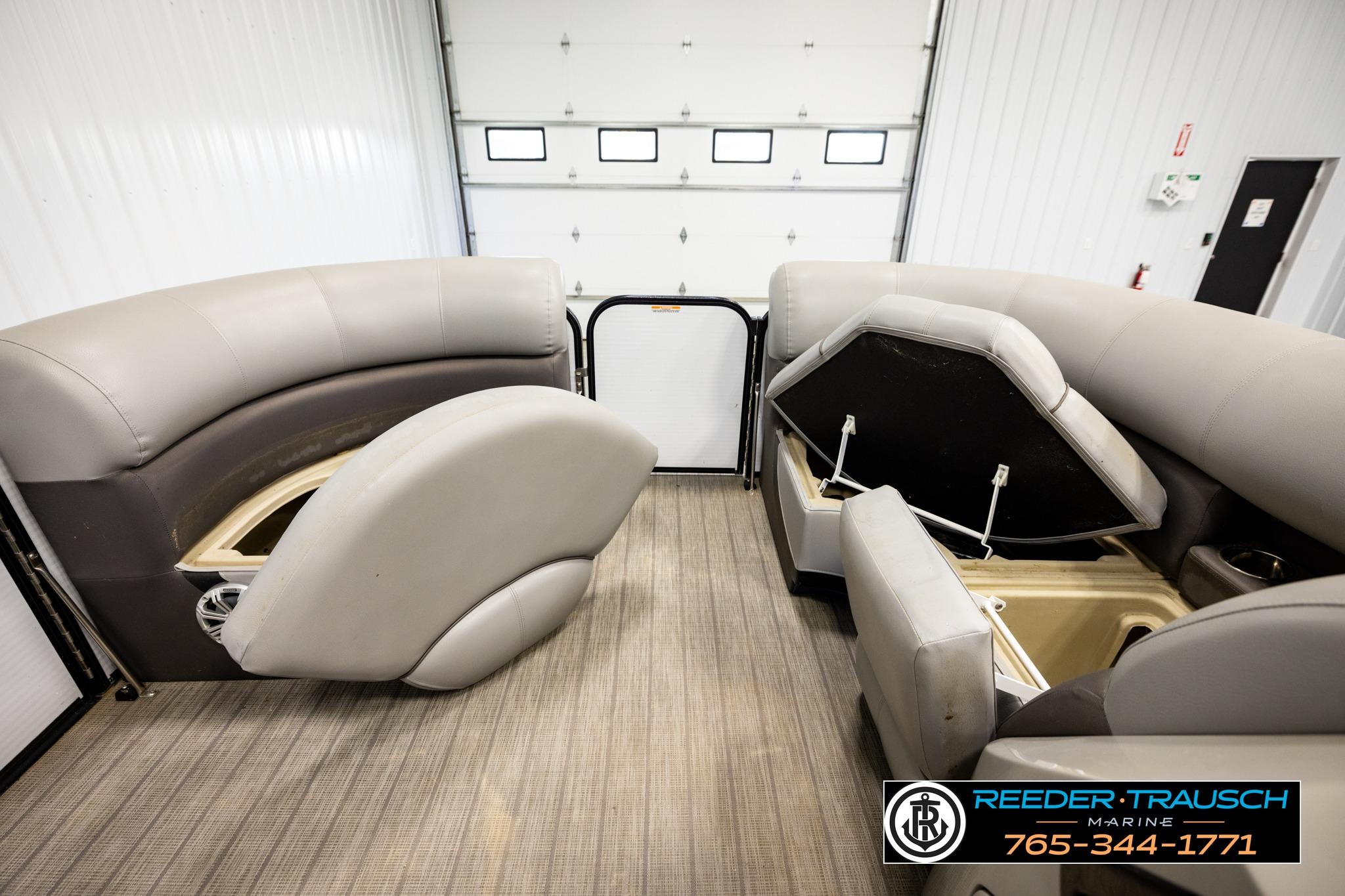 2019 Manitou Oasis SR VP pontoon boat interior with open storage compartments.
