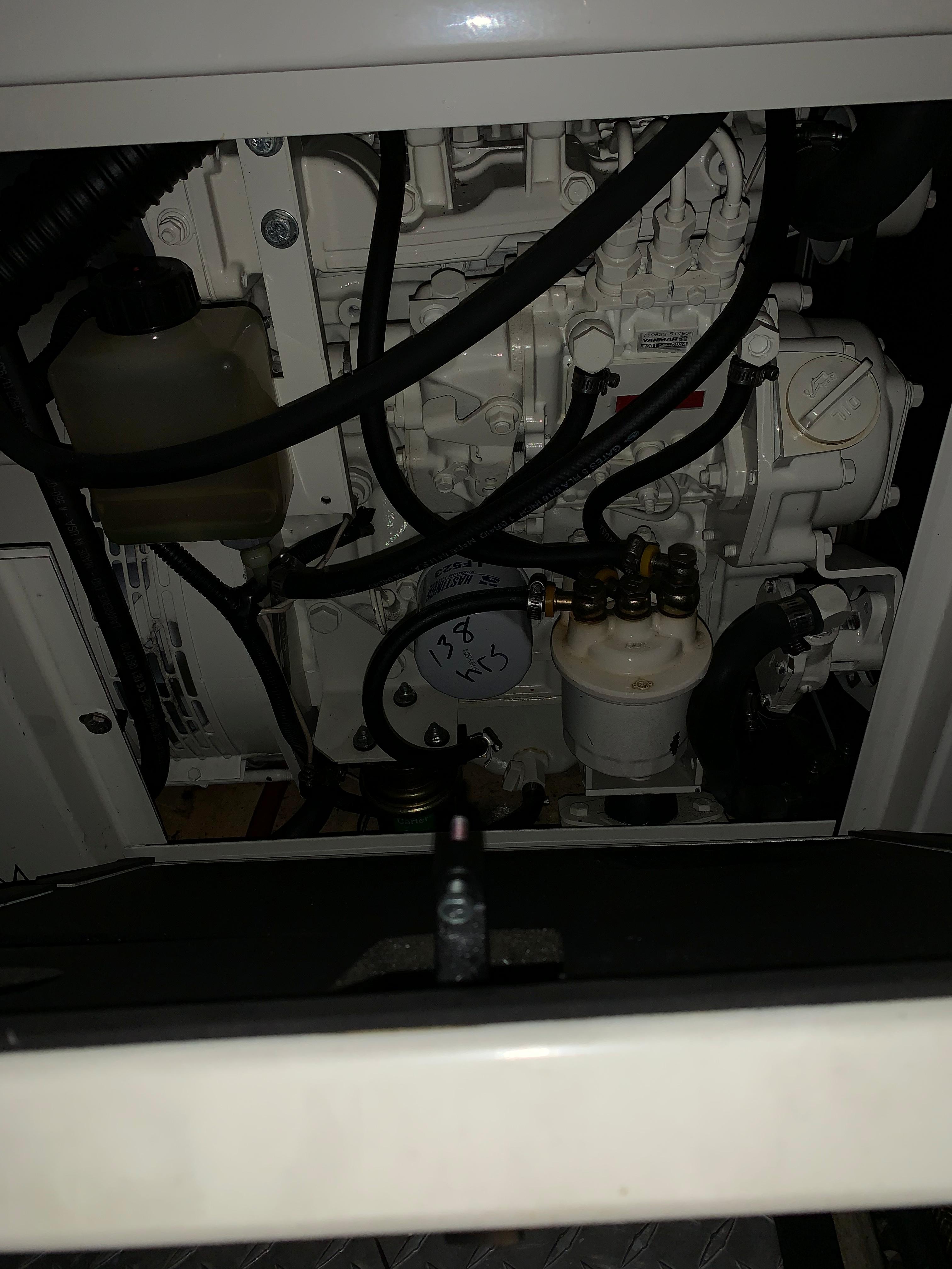 Engine compartment of a 2001 Carver 396 Motor Yacht, showcasing mechanical components.