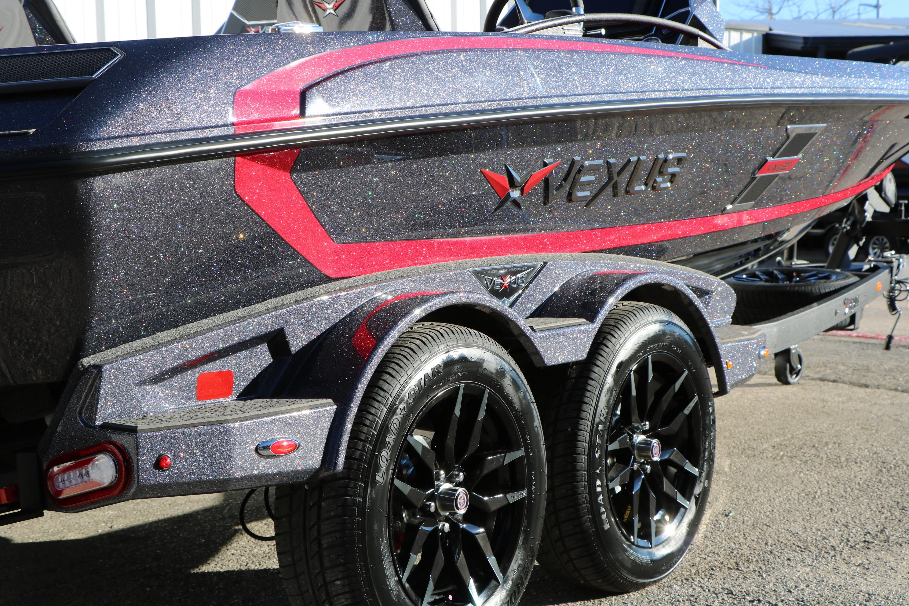 2026 Vexus VXs21 boat with glittery finish and sleek design on a trailer.