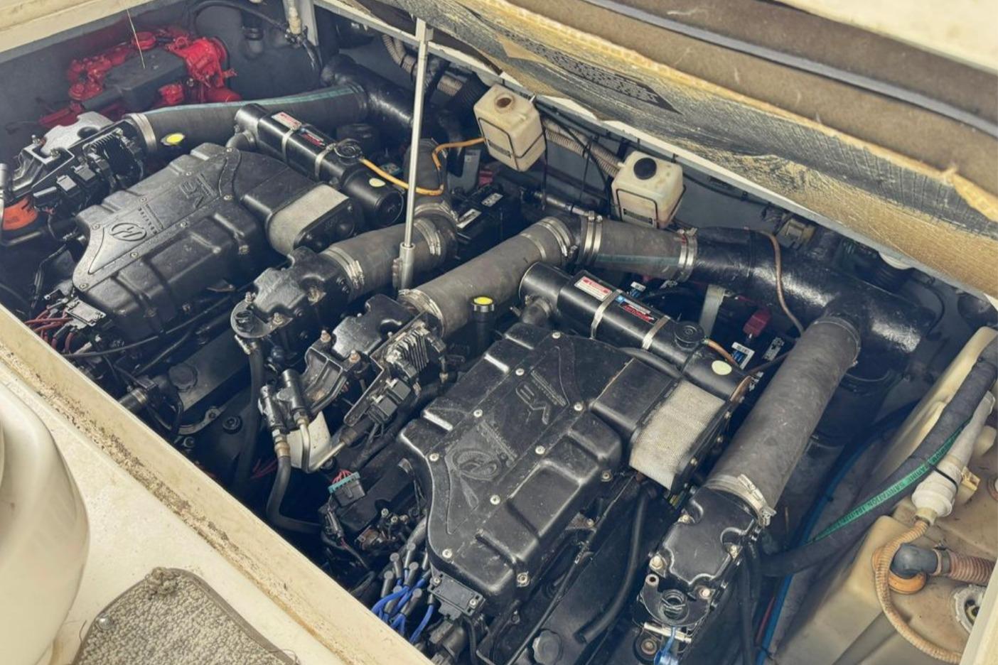 Engine compartment of a 2000 Sea Ray 340 Sundancer boat, showcasing dual engines.
