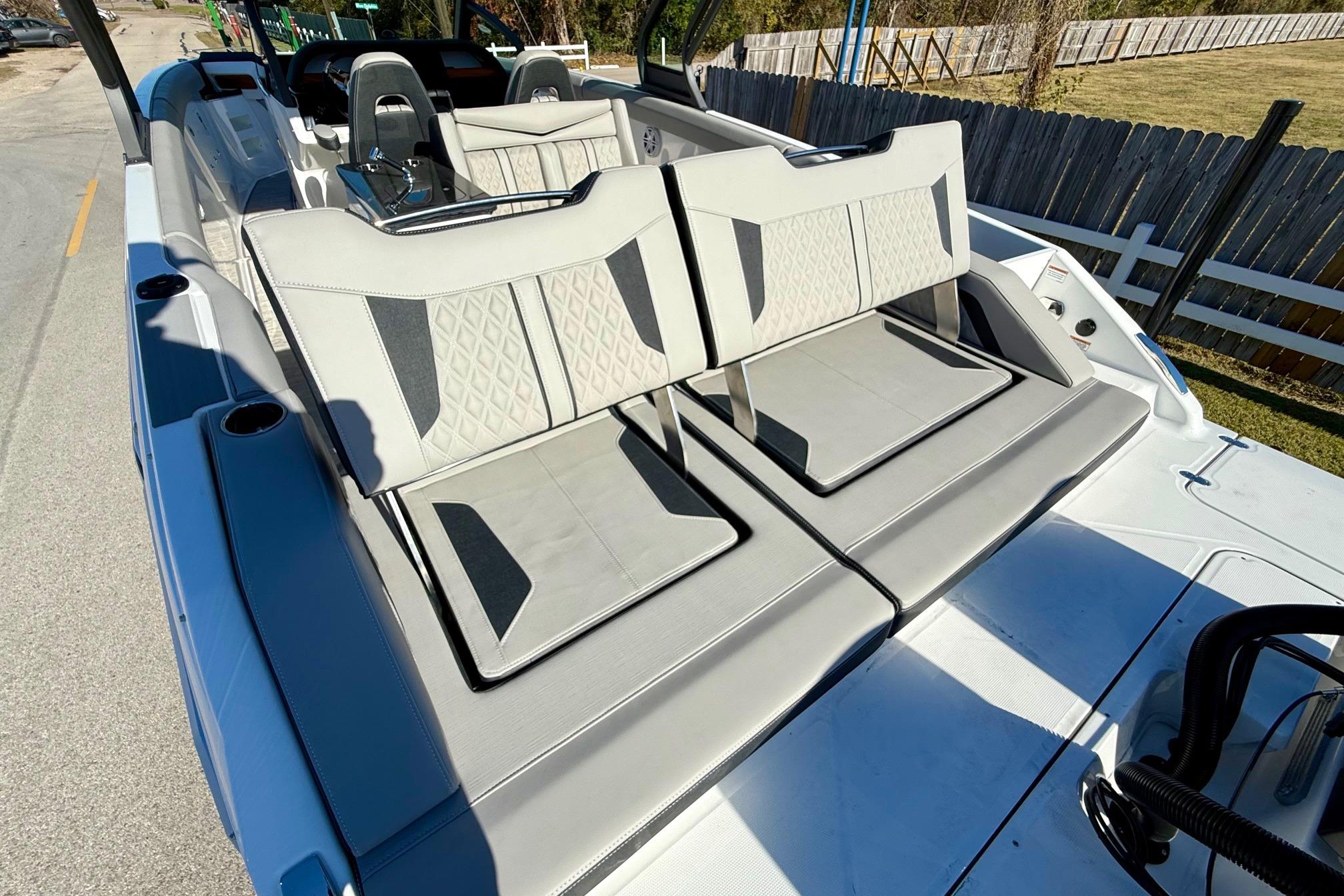 2026 Monterey Elite 30 OB with luxurious outdoor seating.