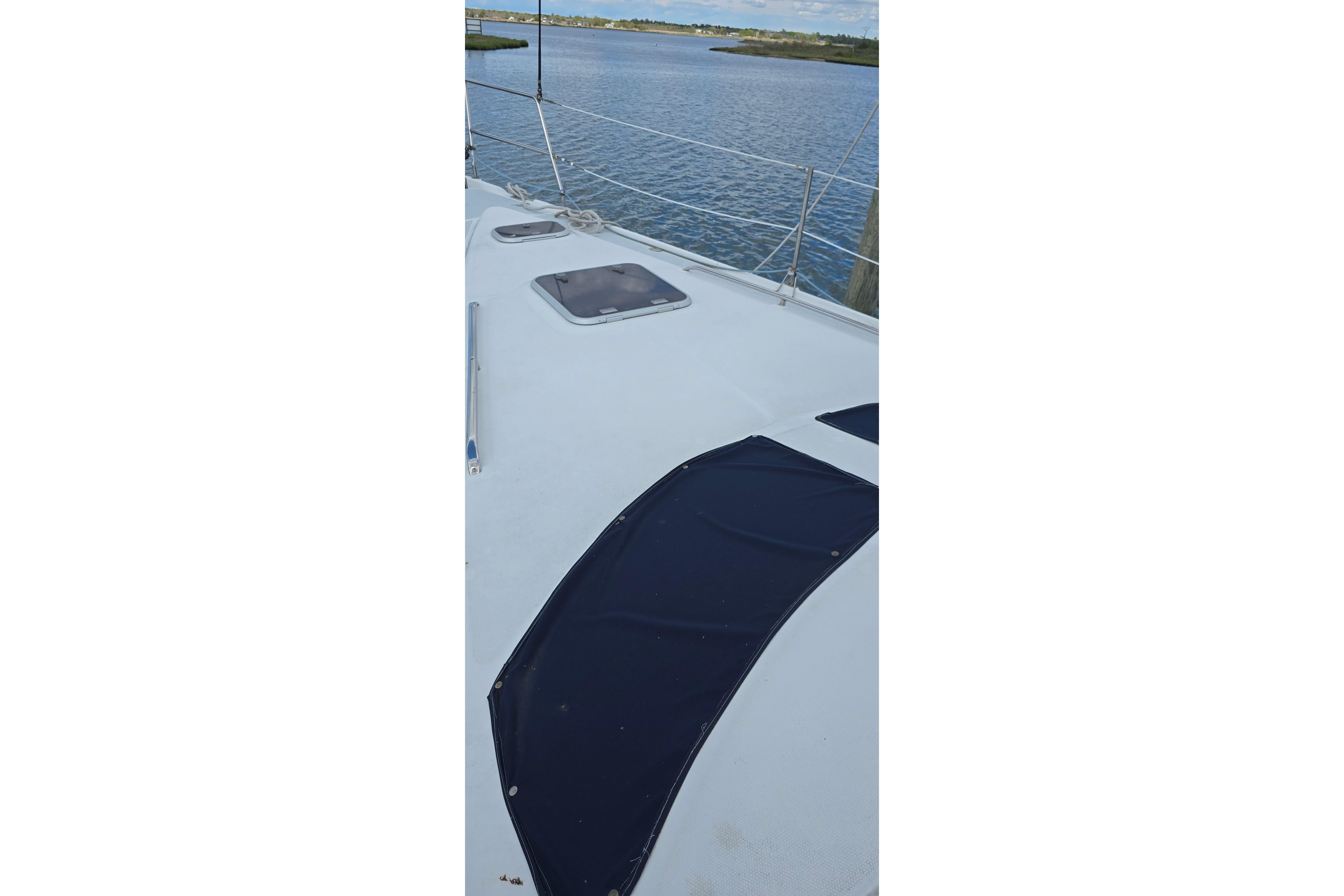 Deck of 1998 Hunter 410 sailboat with water view.