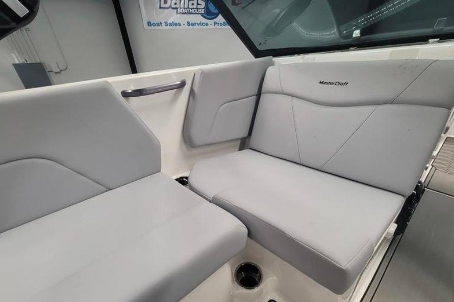 2022 MasterCraft NXT24 boat interior with gray seating and branding.