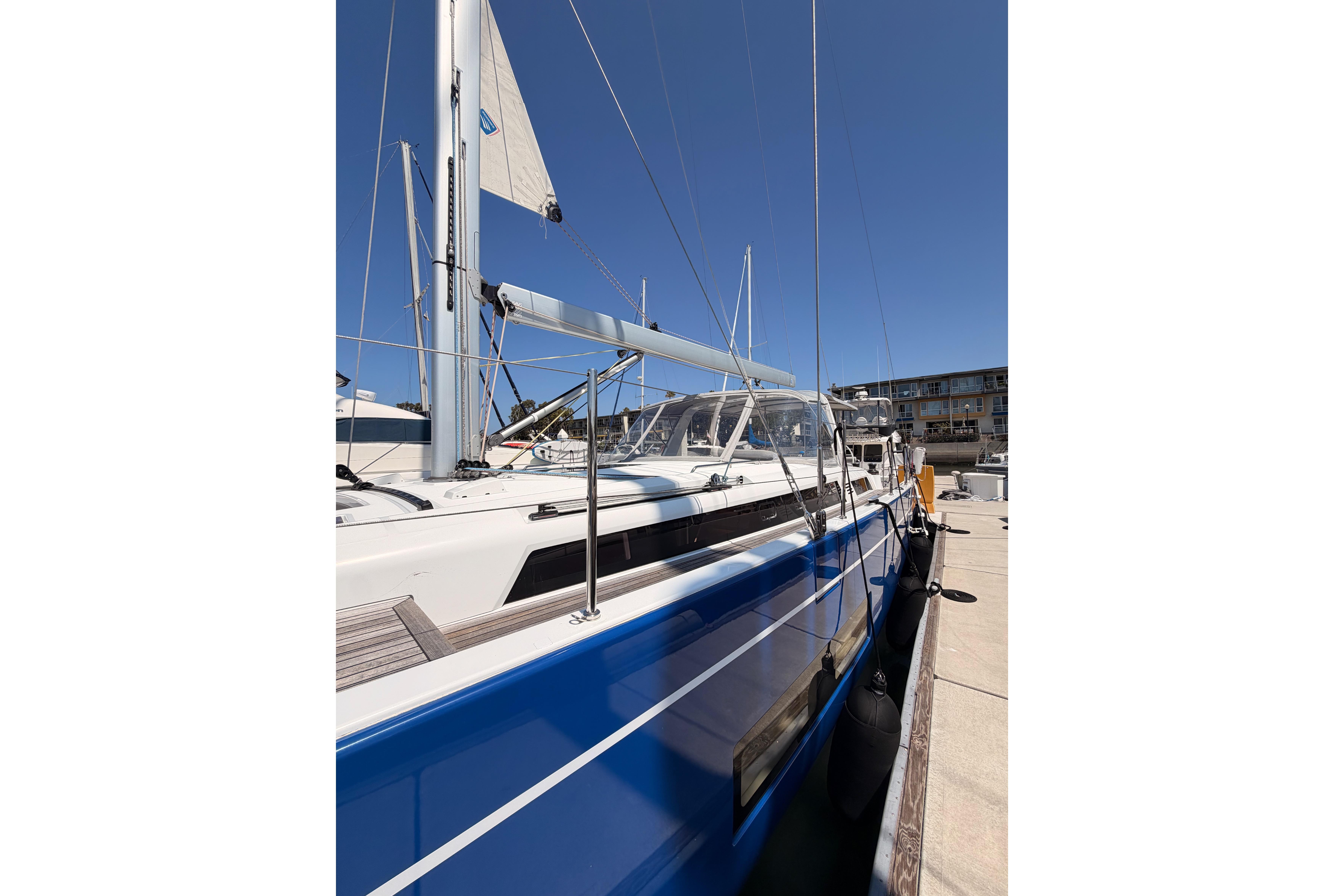 2022 Beneteau Oceanis Yacht 54 docked, showcasing sleek blue hull and modern design.