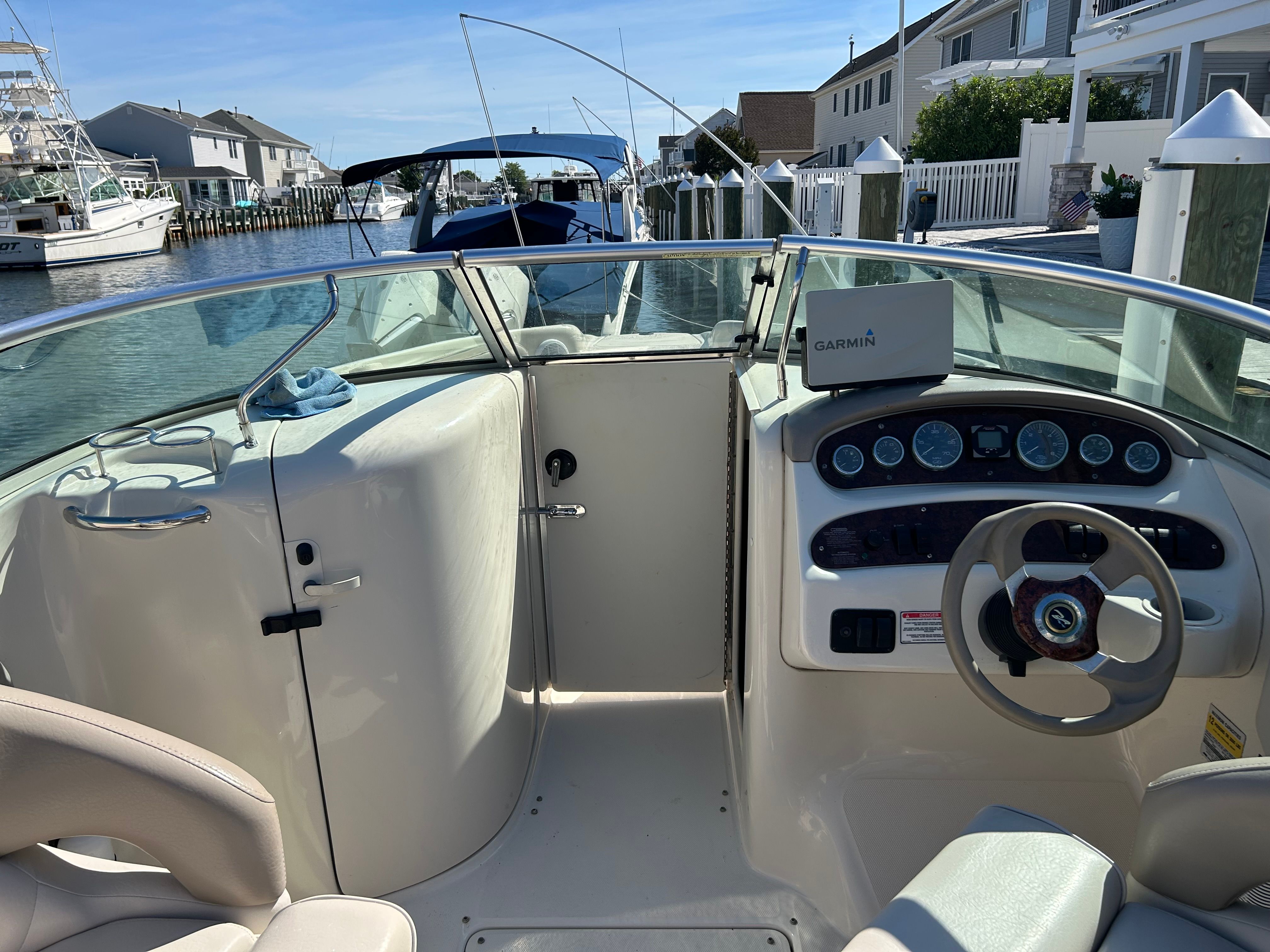 Interior view of a 2003 Sea Ray 240 Sundeck boat at dock.