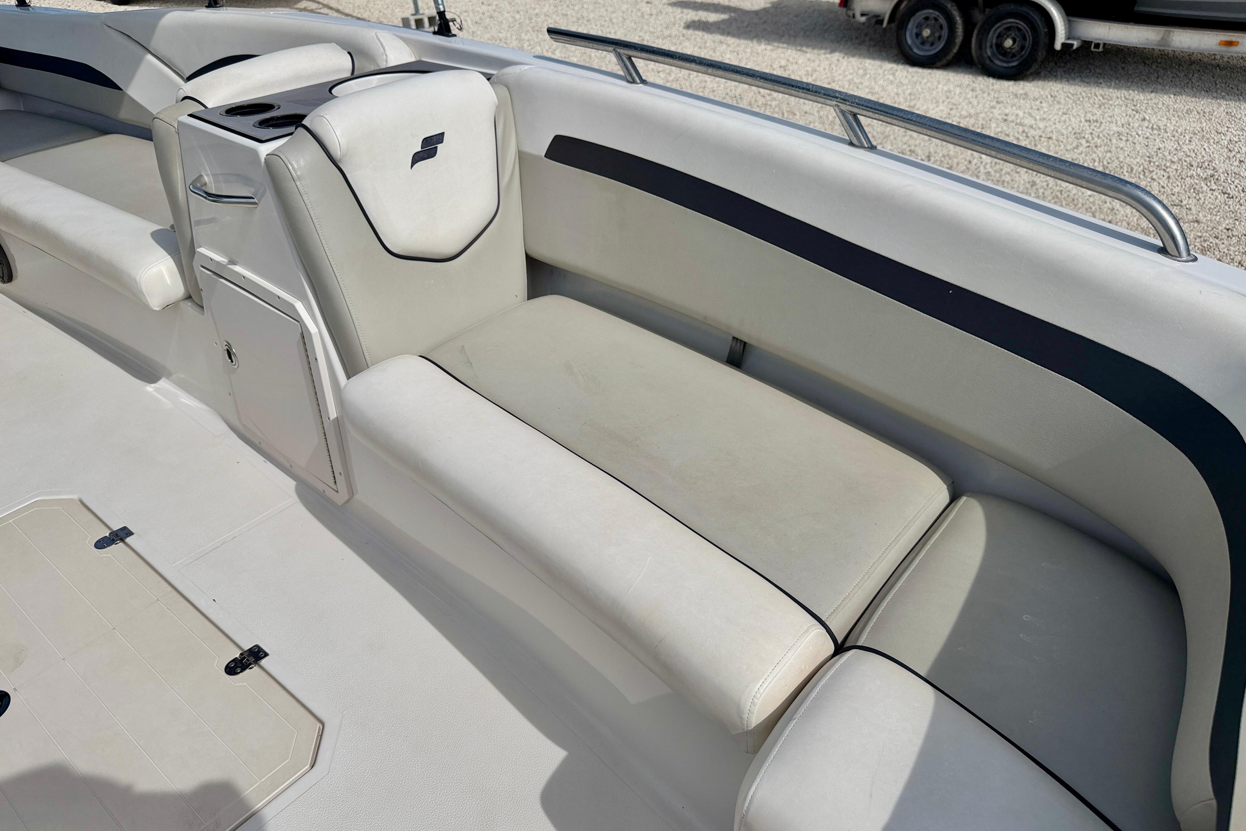 2021 Starcraft SVX 191 OB boat interior with cushioned seating and storage compartment.