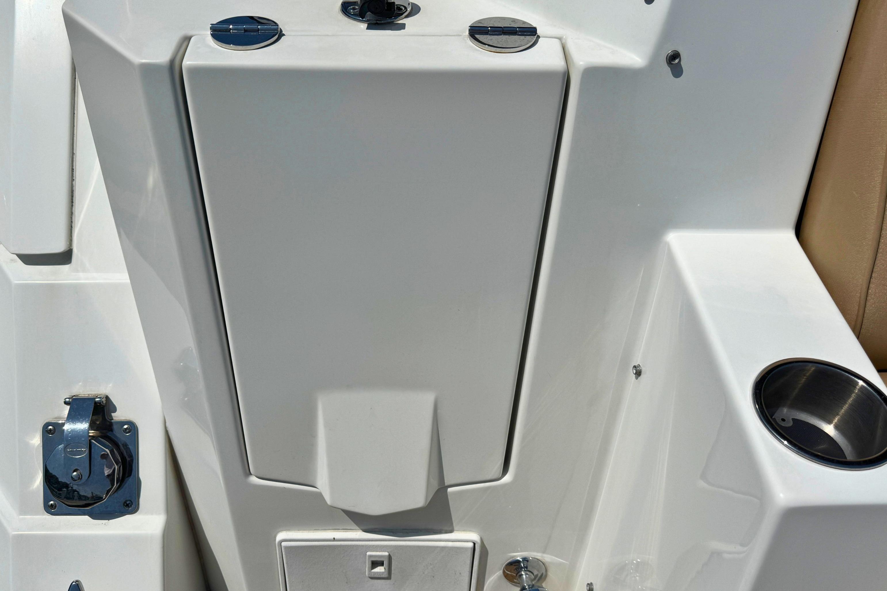 2014 Cruisers Yachts 41 Cantius deck detail with cup holder and storage compartment.