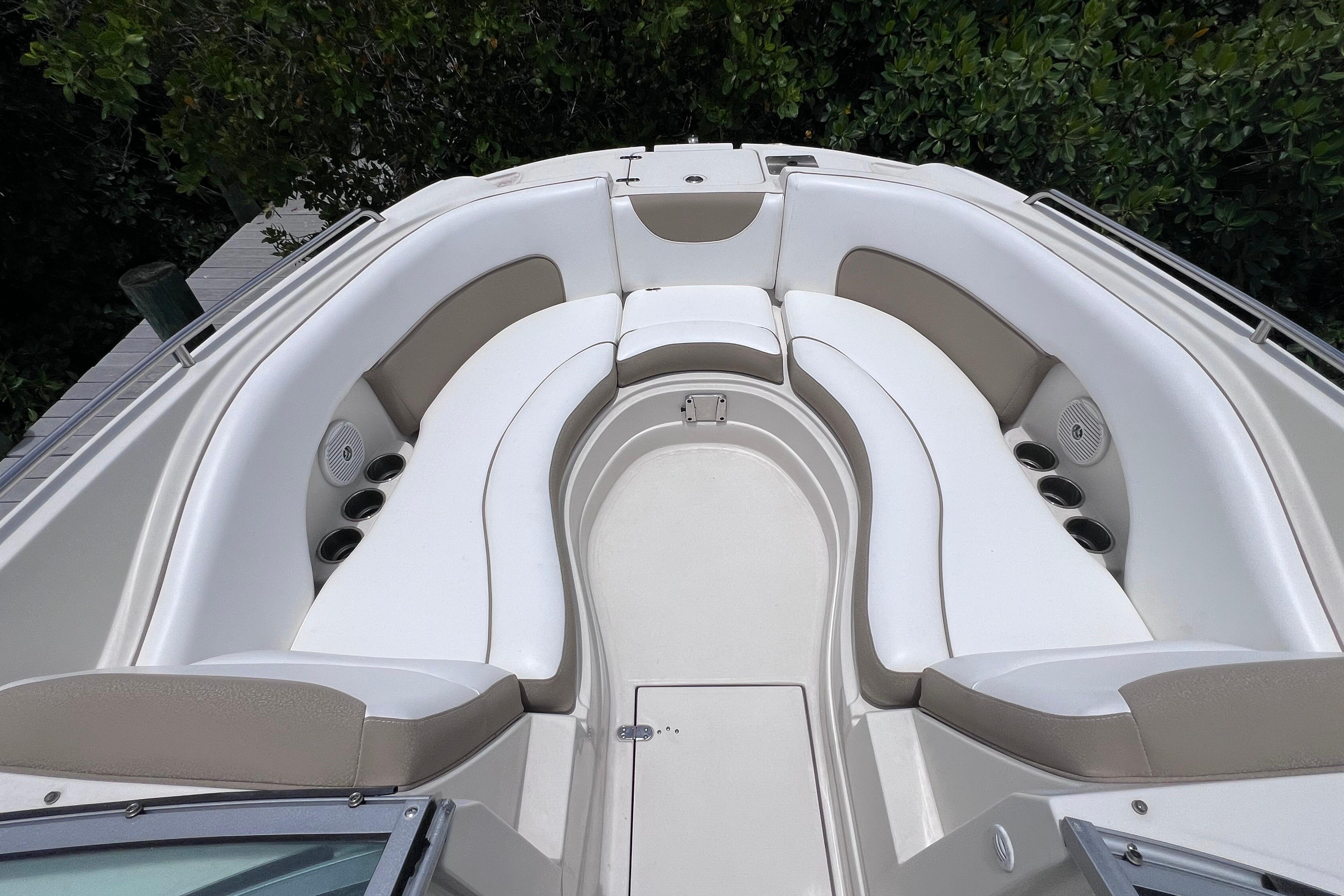 2015 SouthWind 2400 SD boat interior with white seating and cup holders.