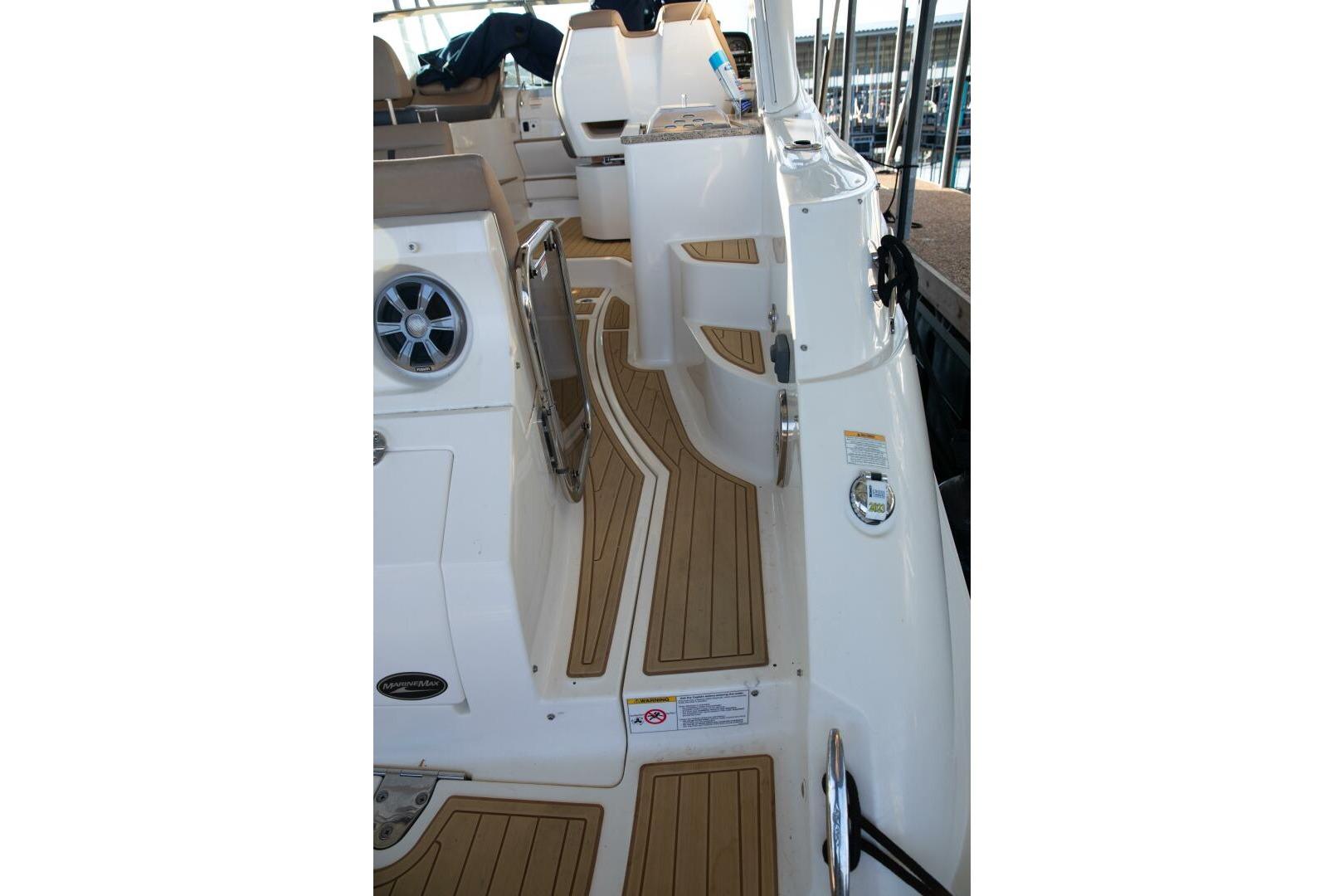 2016 Sea Ray 350 Sundancer boat interior with teak flooring and modern design.