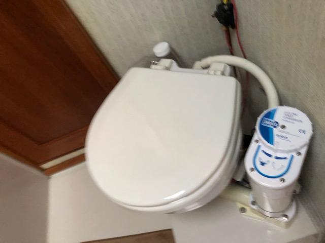 1988 Bayliner 3818 Motoryacht bathroom with marine toilet and pump system.