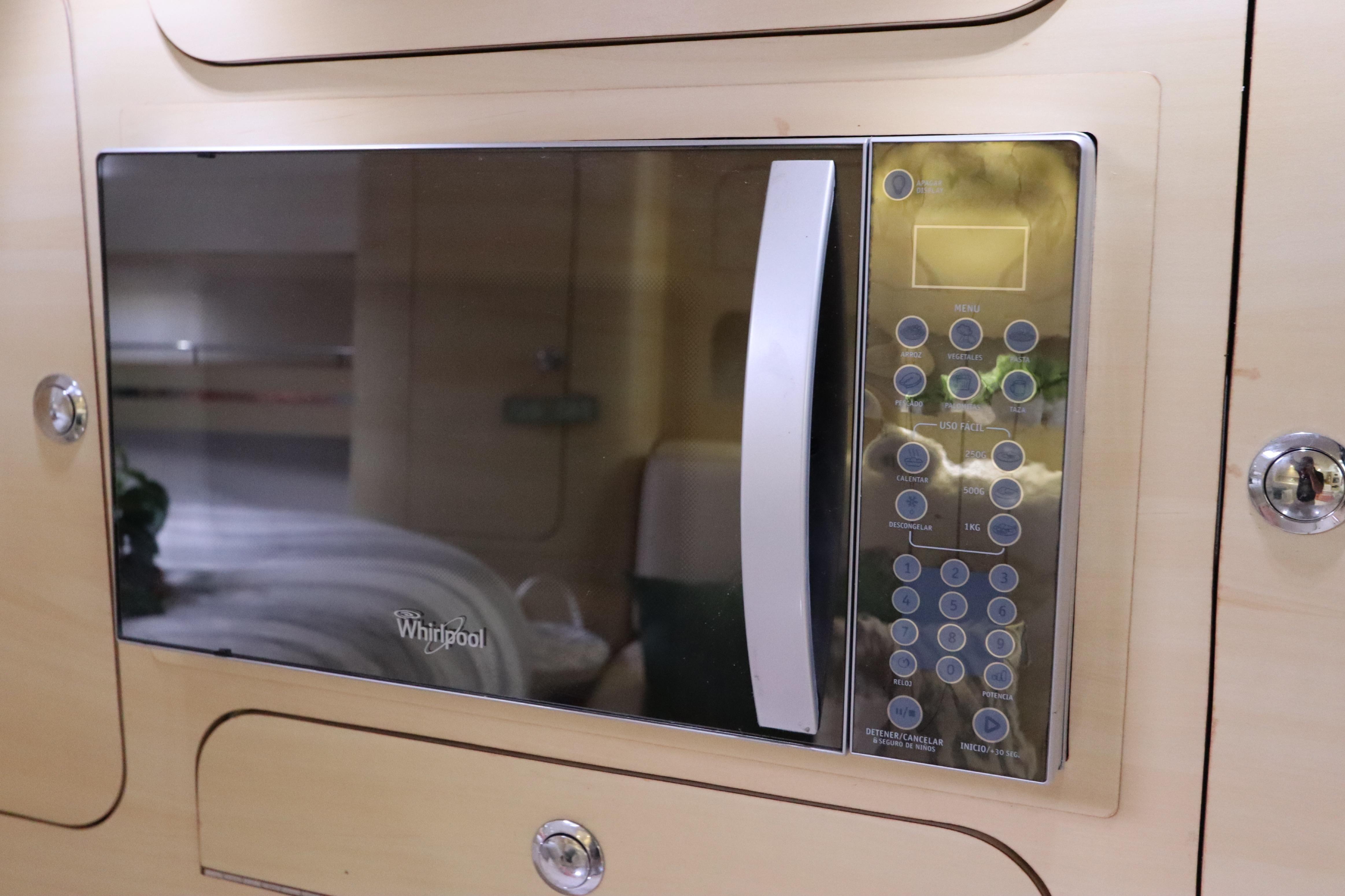 Built-in Whirlpool microwave in 2014 Intermarine 380 Sport yacht interior.