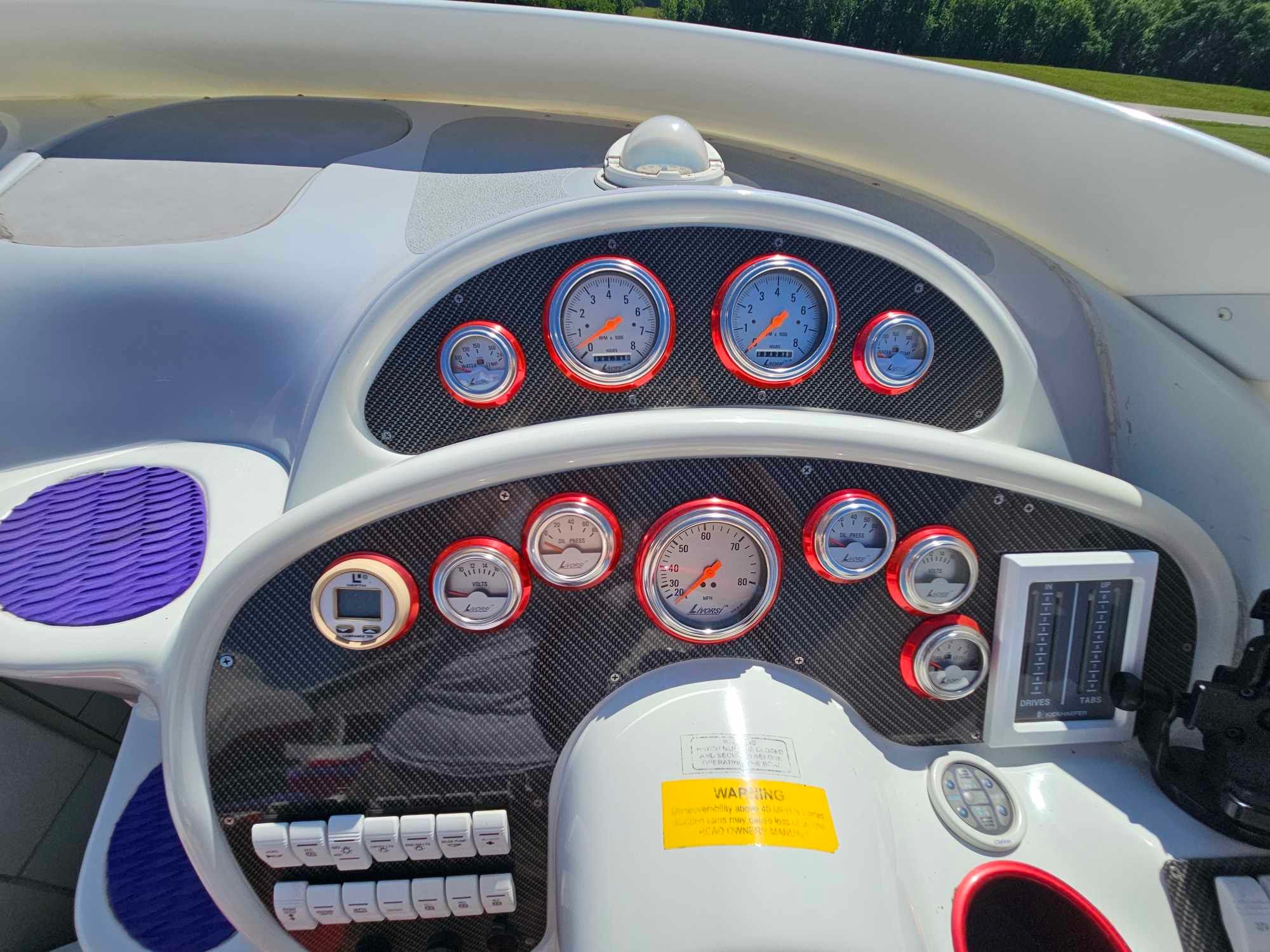 Dashboard of a 1997 Baja 38 Special Boss boat with gauges.