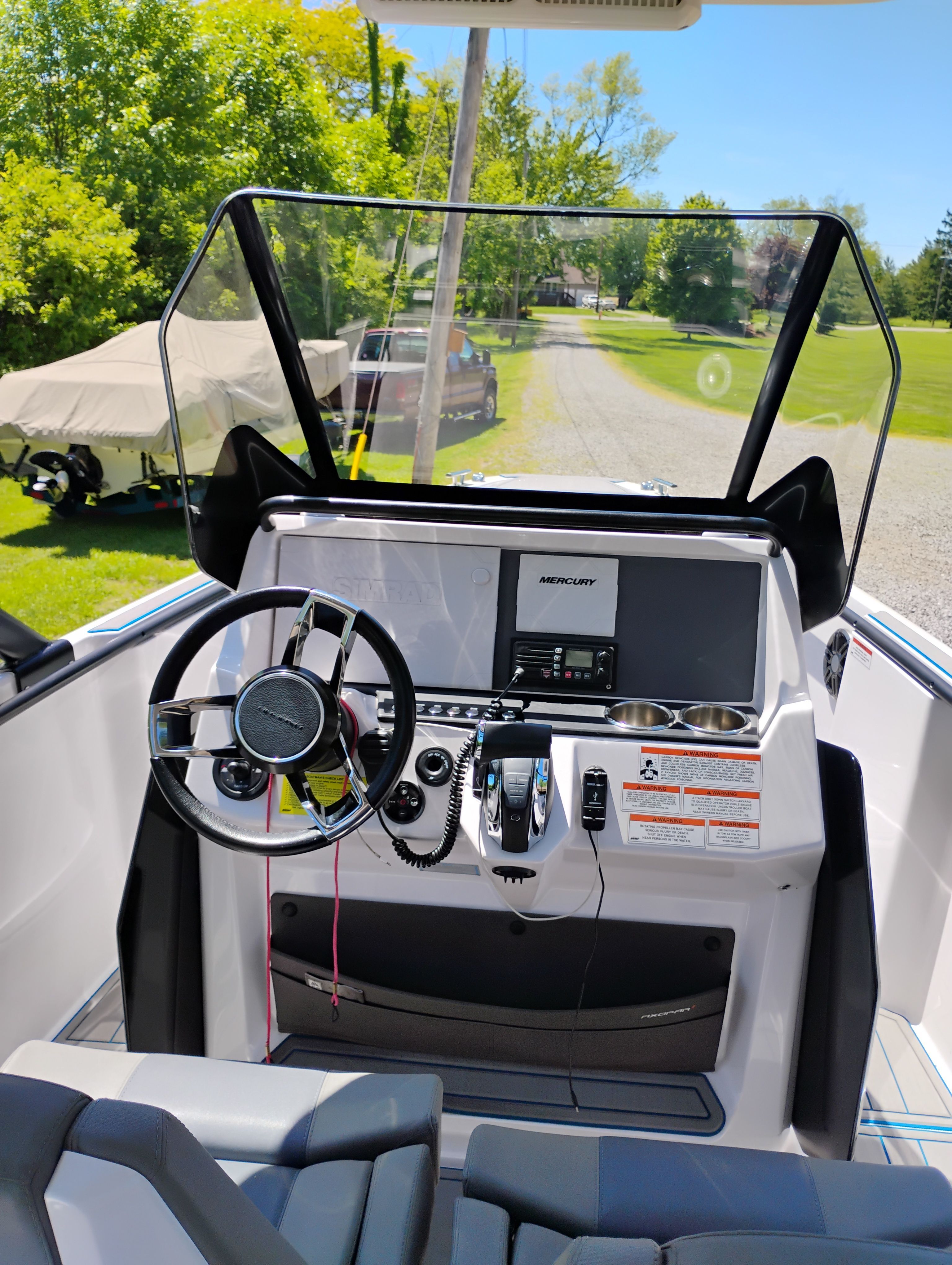 Interior view of 2022 Axopar 22 T-Top with helm console.