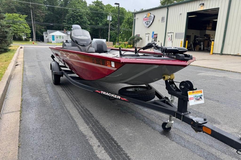 2022 Tracker Pro 170 boat on trailer outside a dealership.