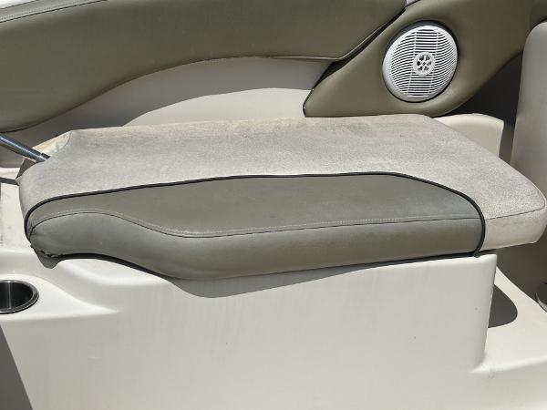 2005 Sea Ray 240 SD boat seat with speaker, featuring beige and gray upholstery.