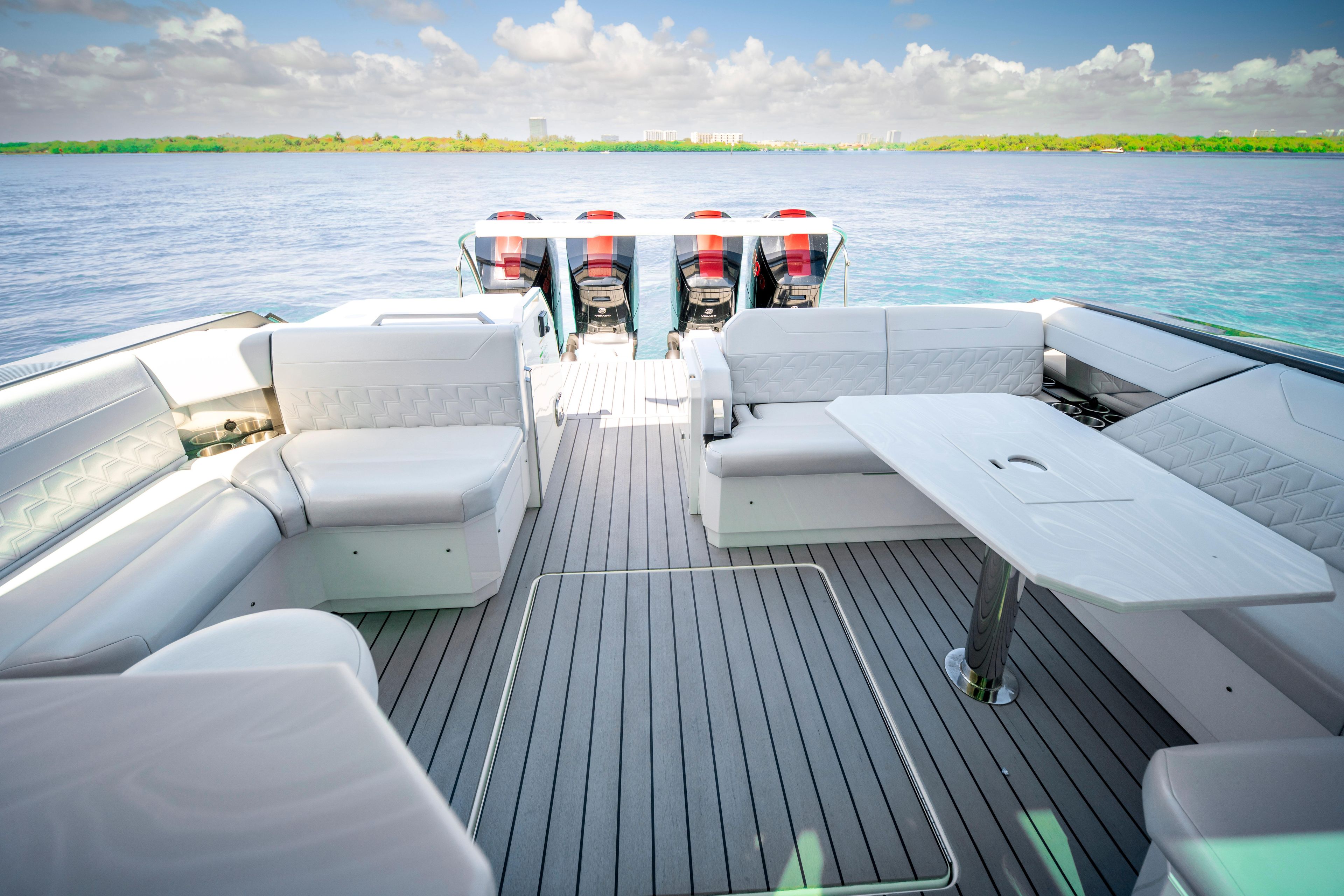 Luxurious 2022 Formula 500 Super Sport Crossover boat interior with spacious seating and table.