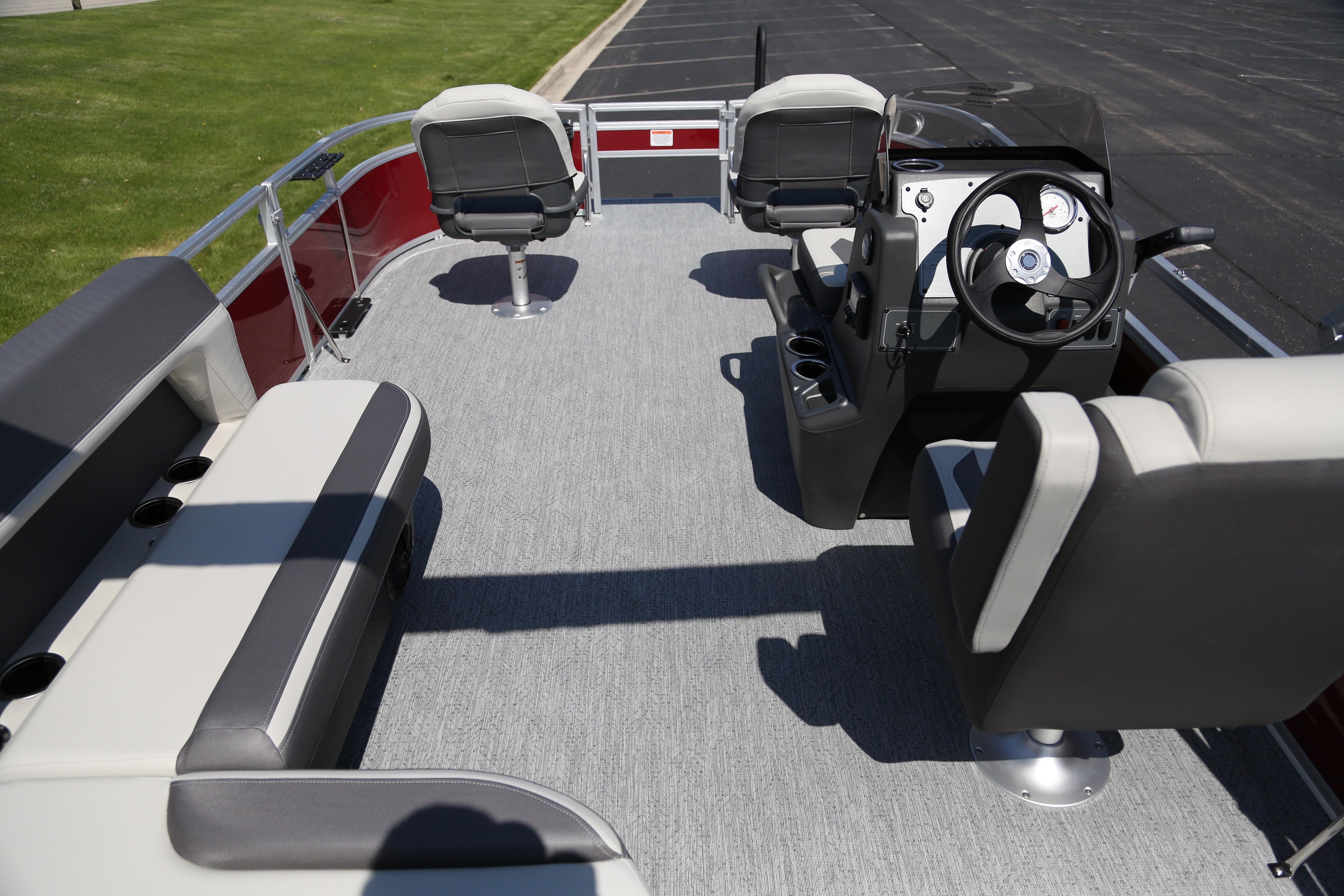 2026 Sun Tracker Bass Buggy 16 XL Select pontoon boat interior with seating and steering console.