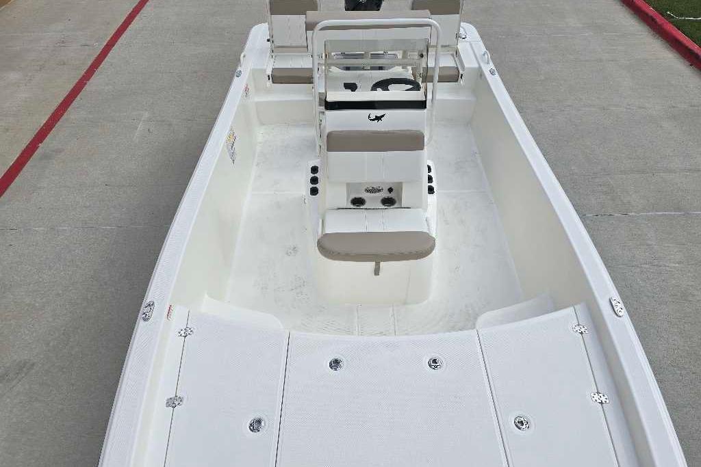 2026 Mako Pro Skiff 19 CC boat interior with seating and steering console.