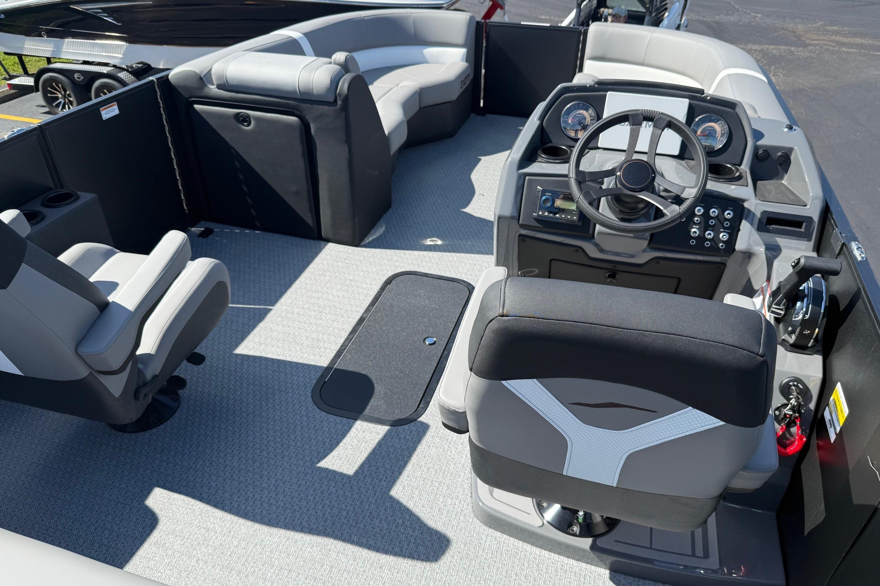 Interior of 2026 Evotti 521CS boat with modern seating and steering console.