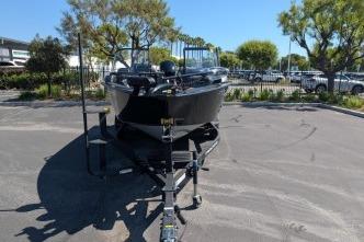 2026 Tracker Targa V-18 WT boat on trailer in parking lot.