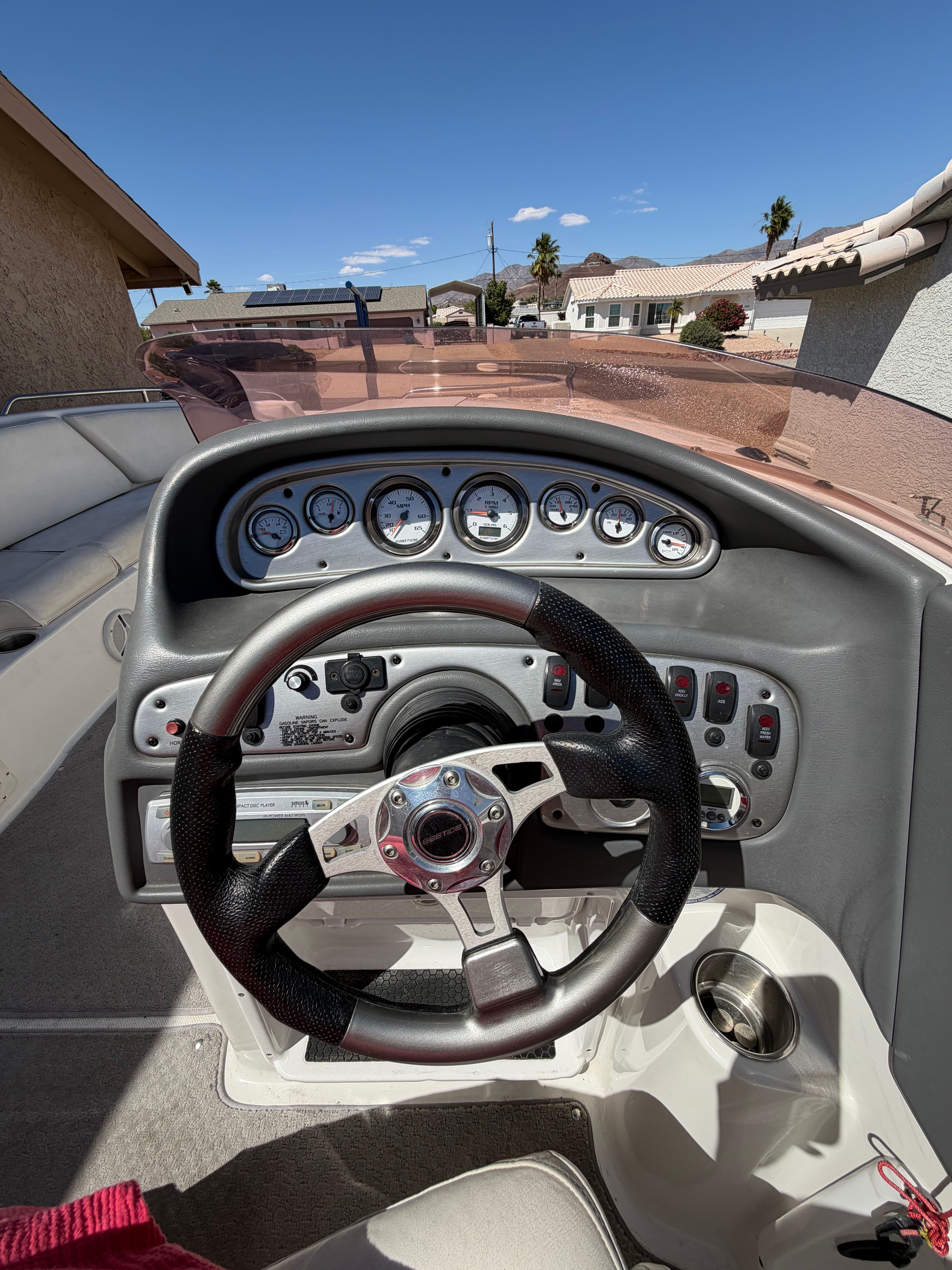 The image shows the cockpit of a 2008 Ebbtide 2100 SS Fun Cruiser O/B with a modern dashboard.
