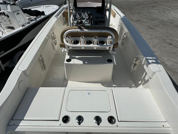2021 Bayliner Trophy T22CC center console boat interior with rod holders and storage compartments.