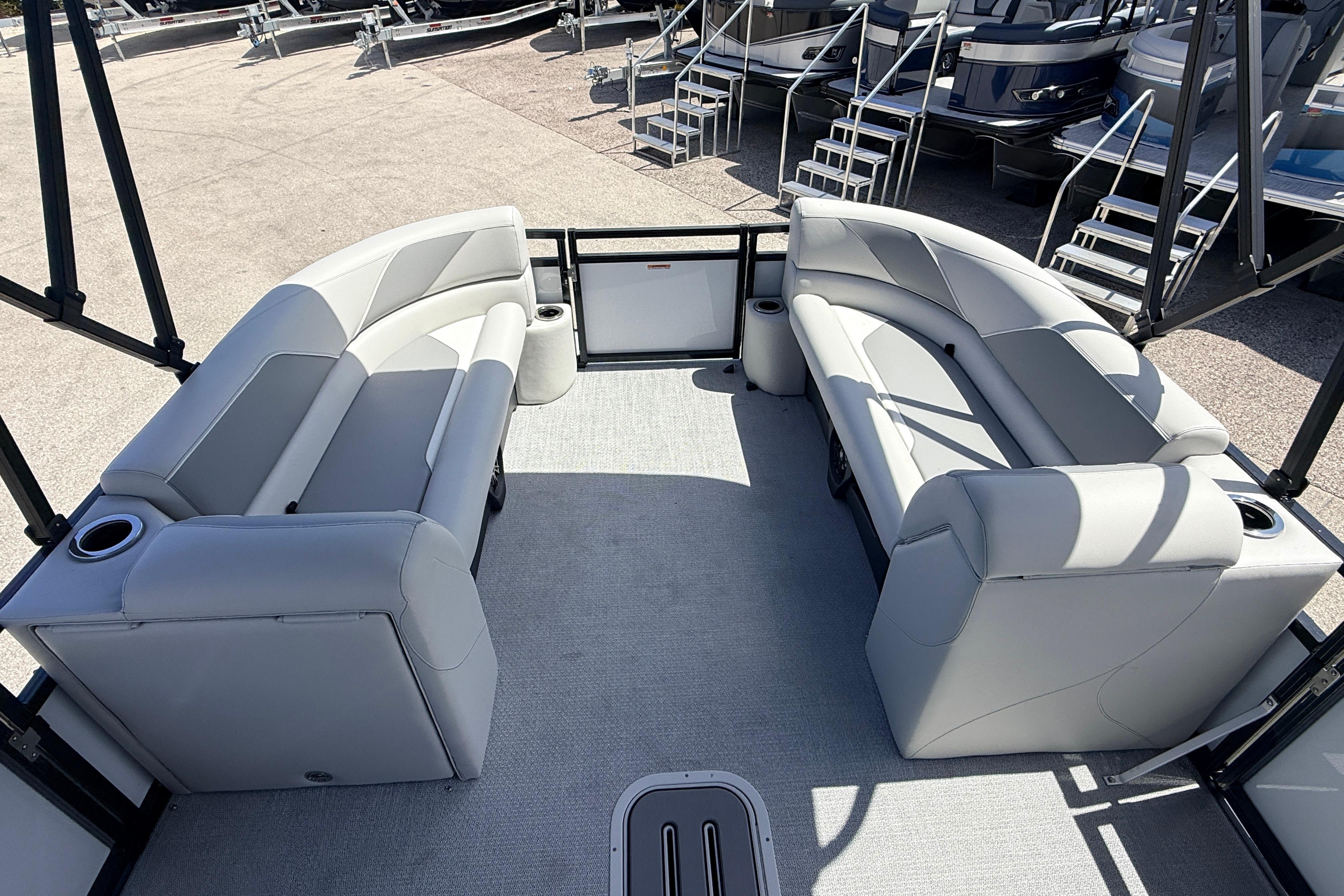 2026 Avalon 2385 Venture 85 Tri Toon boat interior with plush seating and cup holders.