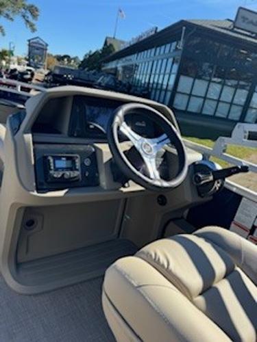 Interior view of 2025 Sun Tracker Fishin' Barge 22 DLX helm.