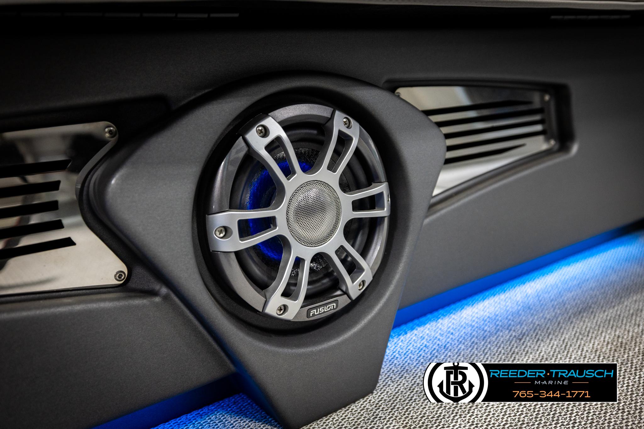 Speaker system in 2025 Avalon 2585 Excal VRBW boat, featuring modern design and blue lighting.