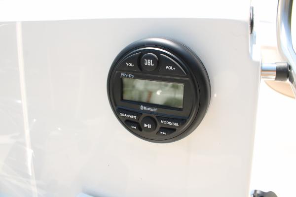 JBL Bluetooth stereo system on 2023 Sundance DX20 boat dashboard.
