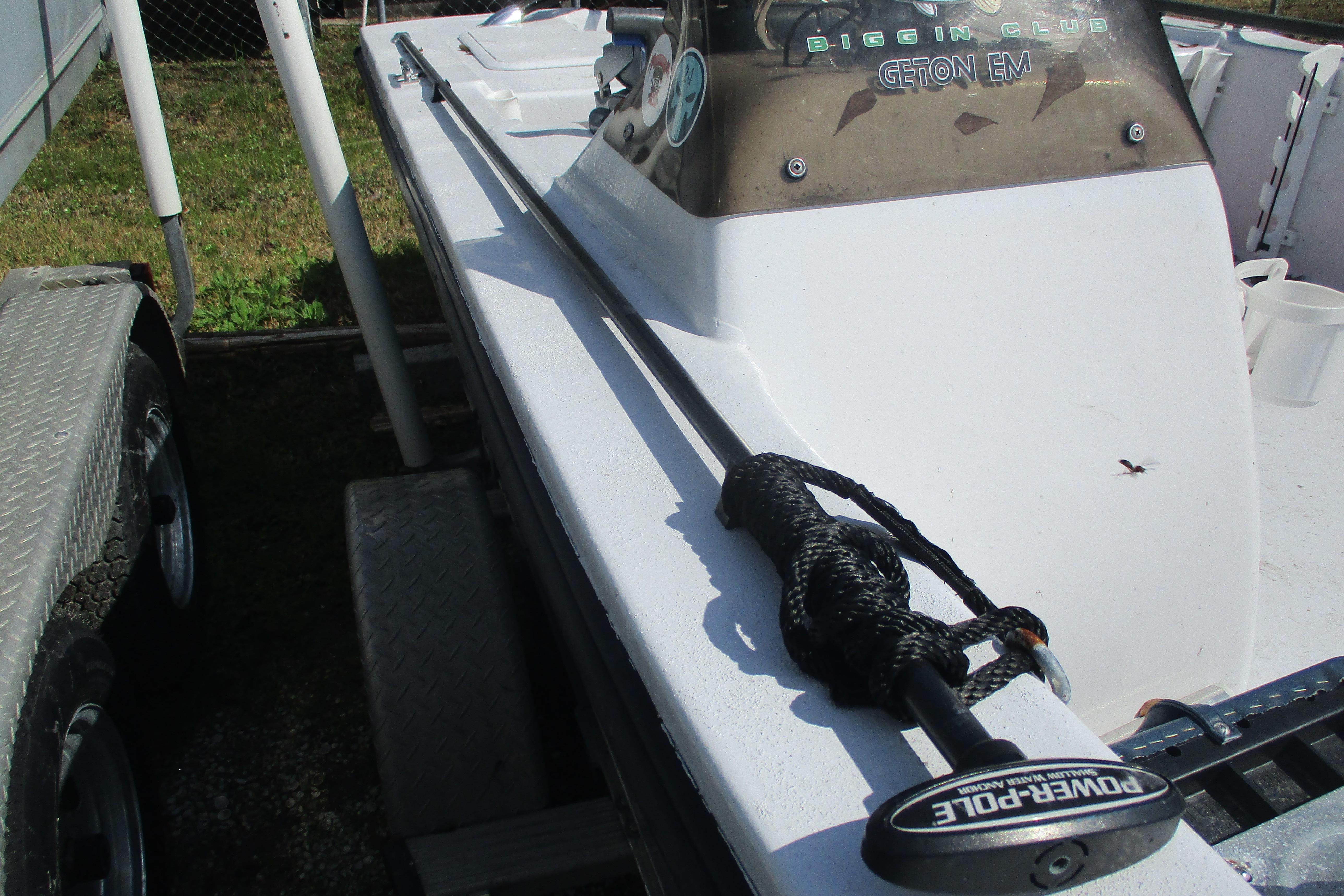 2012 Stumpknocker 17 SPORT boat with Power-Pole anchor, parked on a trailer.