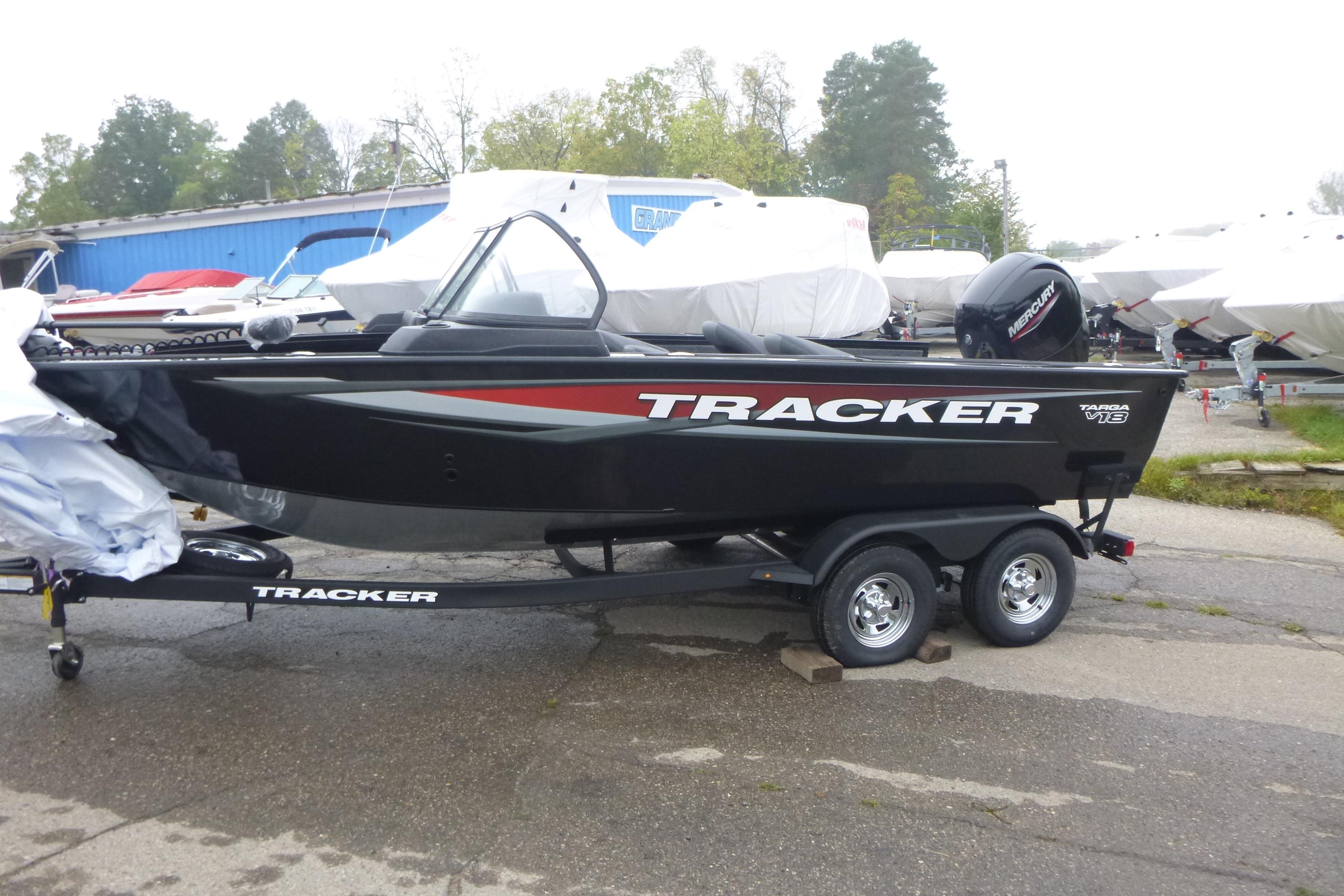 2026 Tracker Targa V-18 Combo boat on trailer, parked outdoors.