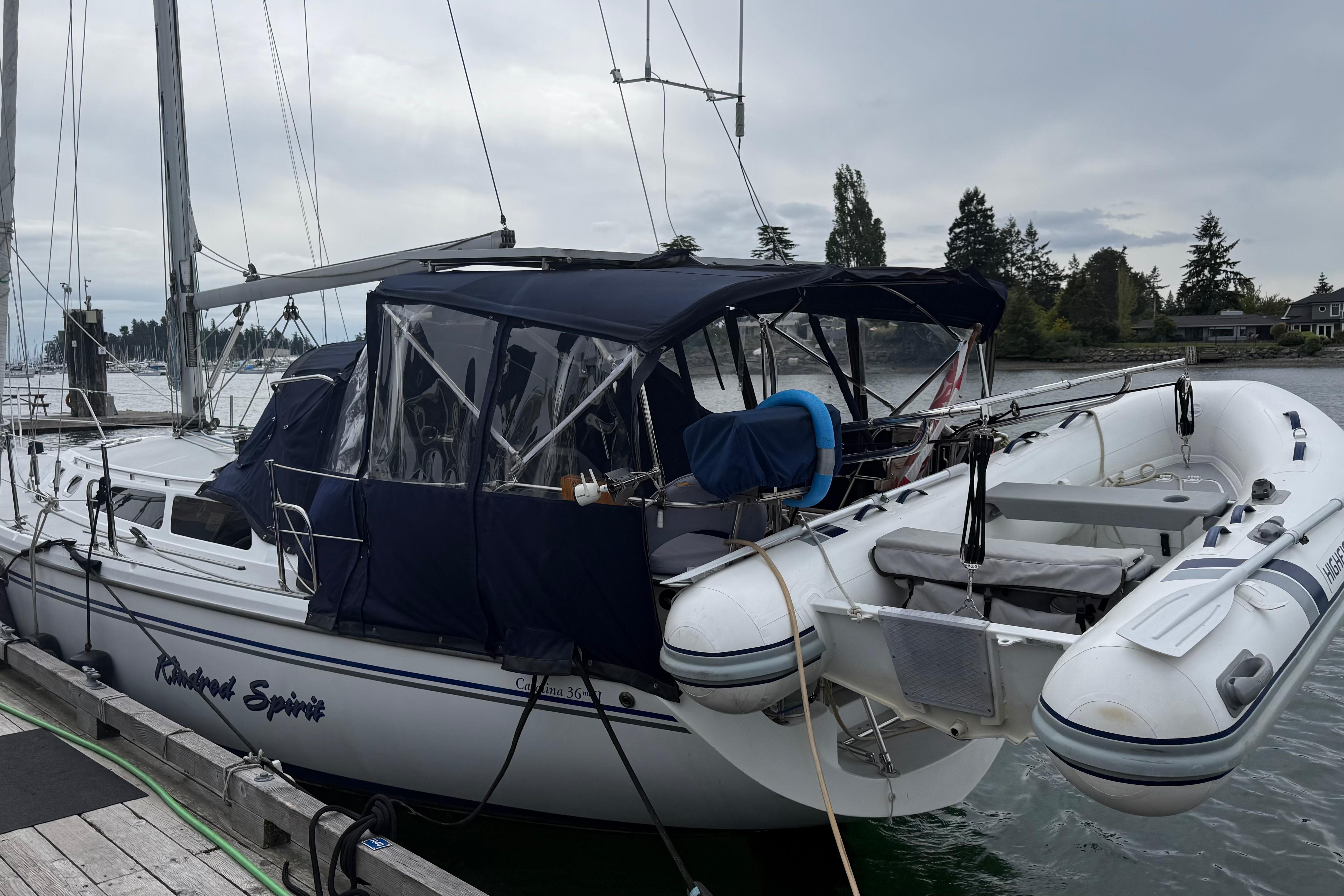 2005 Catalina 36 MkII sailboat docked with inflatable dinghy attached.