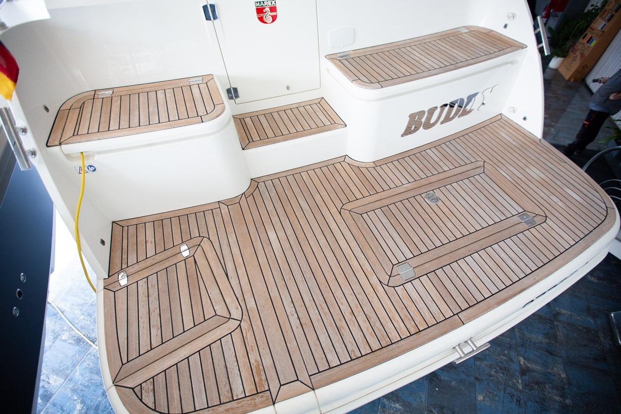 Teak deck of 2022 Marex 360 Cabriolet Cruiser, showcasing elegant wood finish.