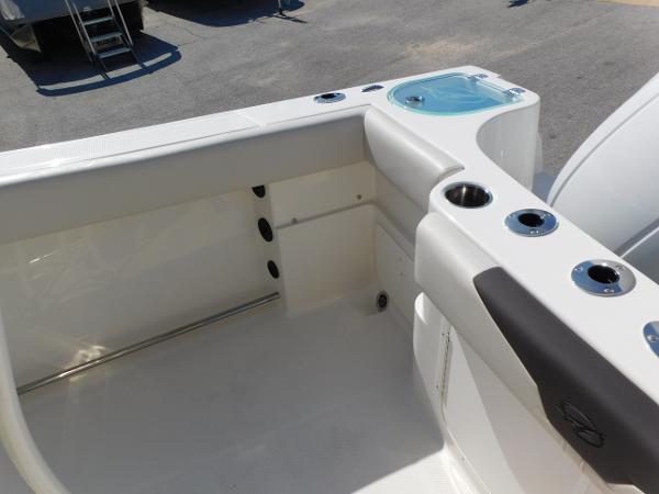 2024 Sailfish 242 CC boat interior with rod holders and storage compartments.