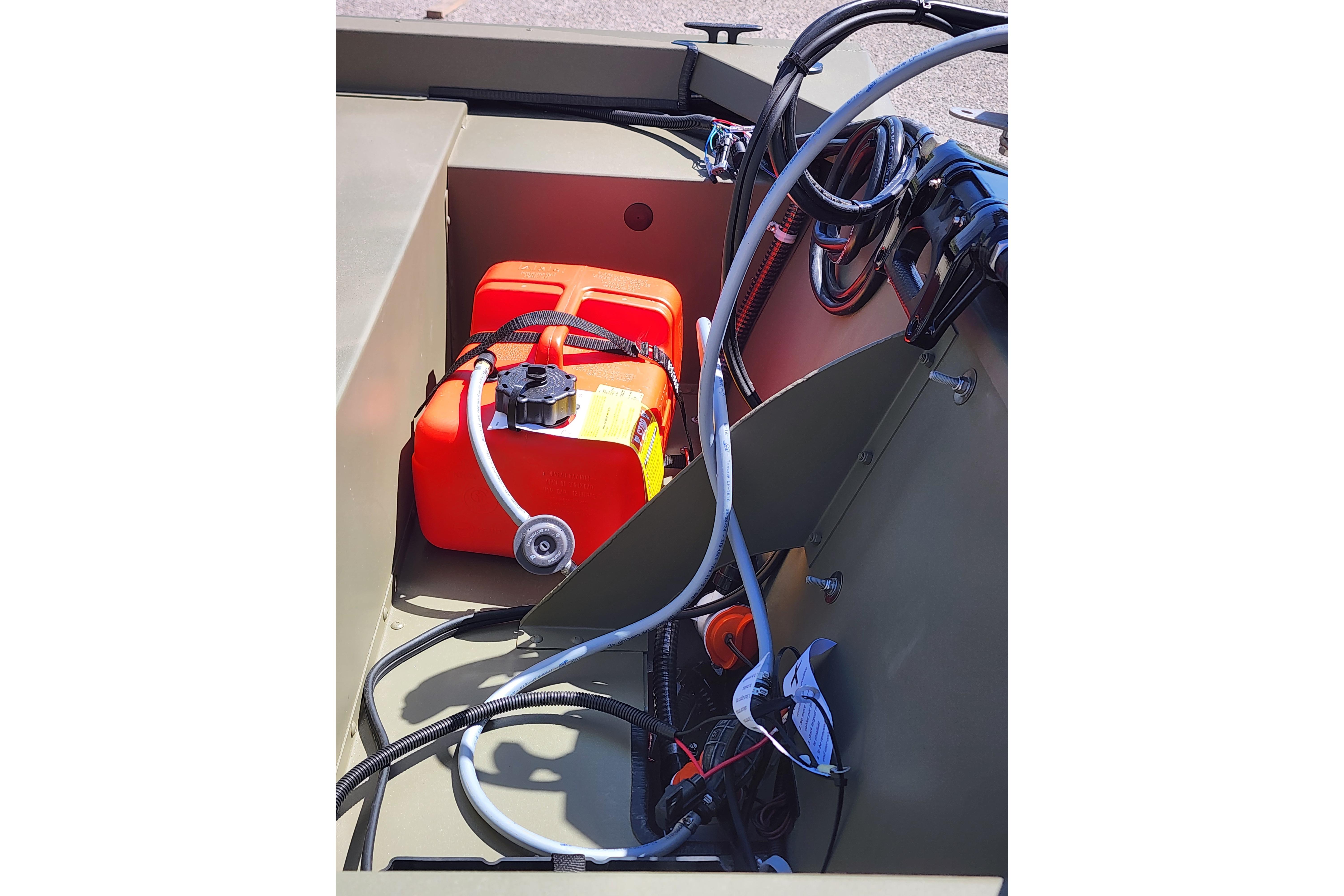 2026 Tracker Grizzly 1648 SC boat interior with fuel tank and wiring.