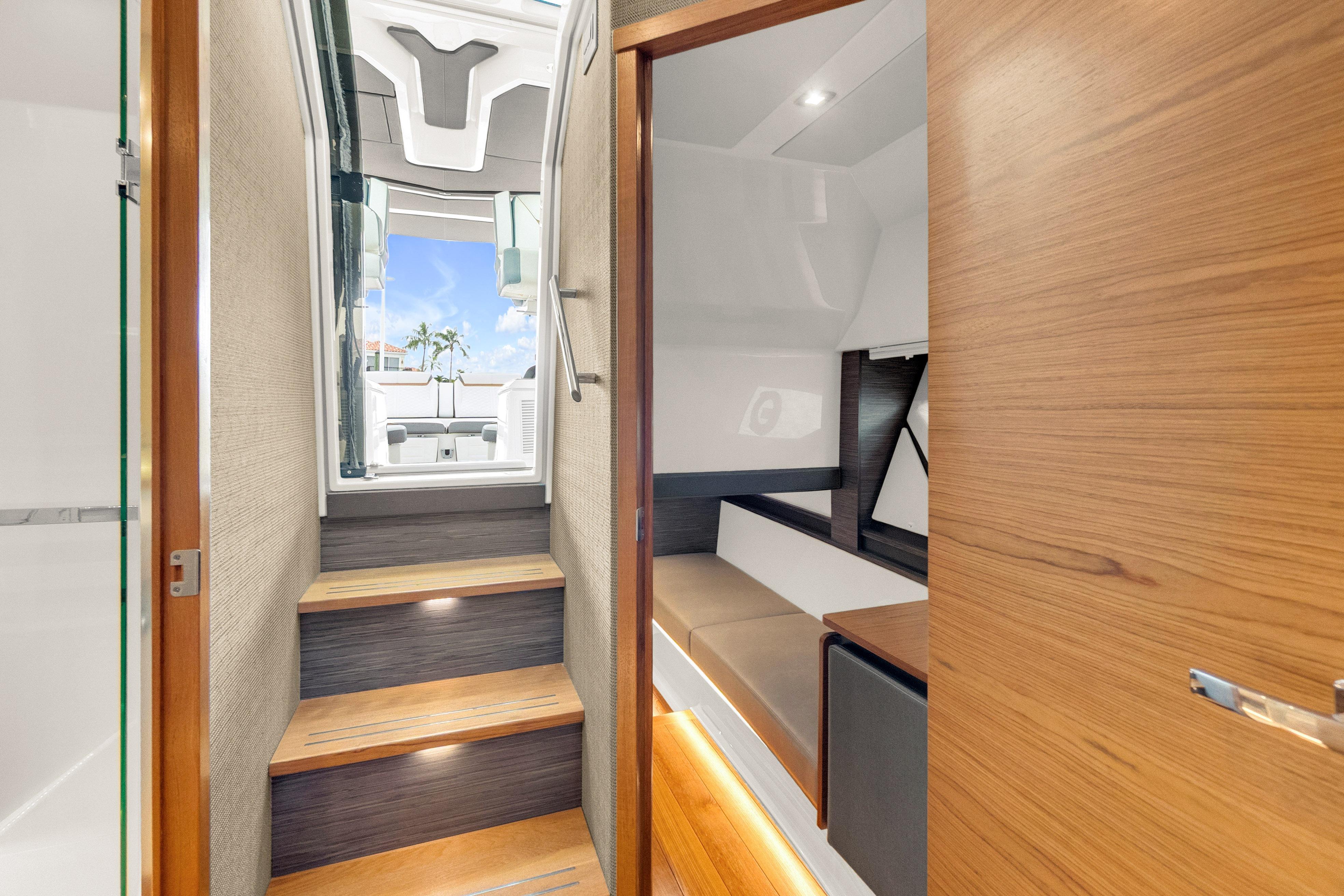 Interior view of 2021 Tiara Sport 43 LE yacht, featuring wooden steps and modern design.