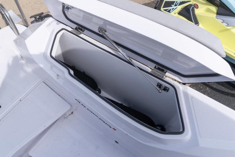 Open storage compartment on 2025 Axopar 29 XC Cross Cabin boat.