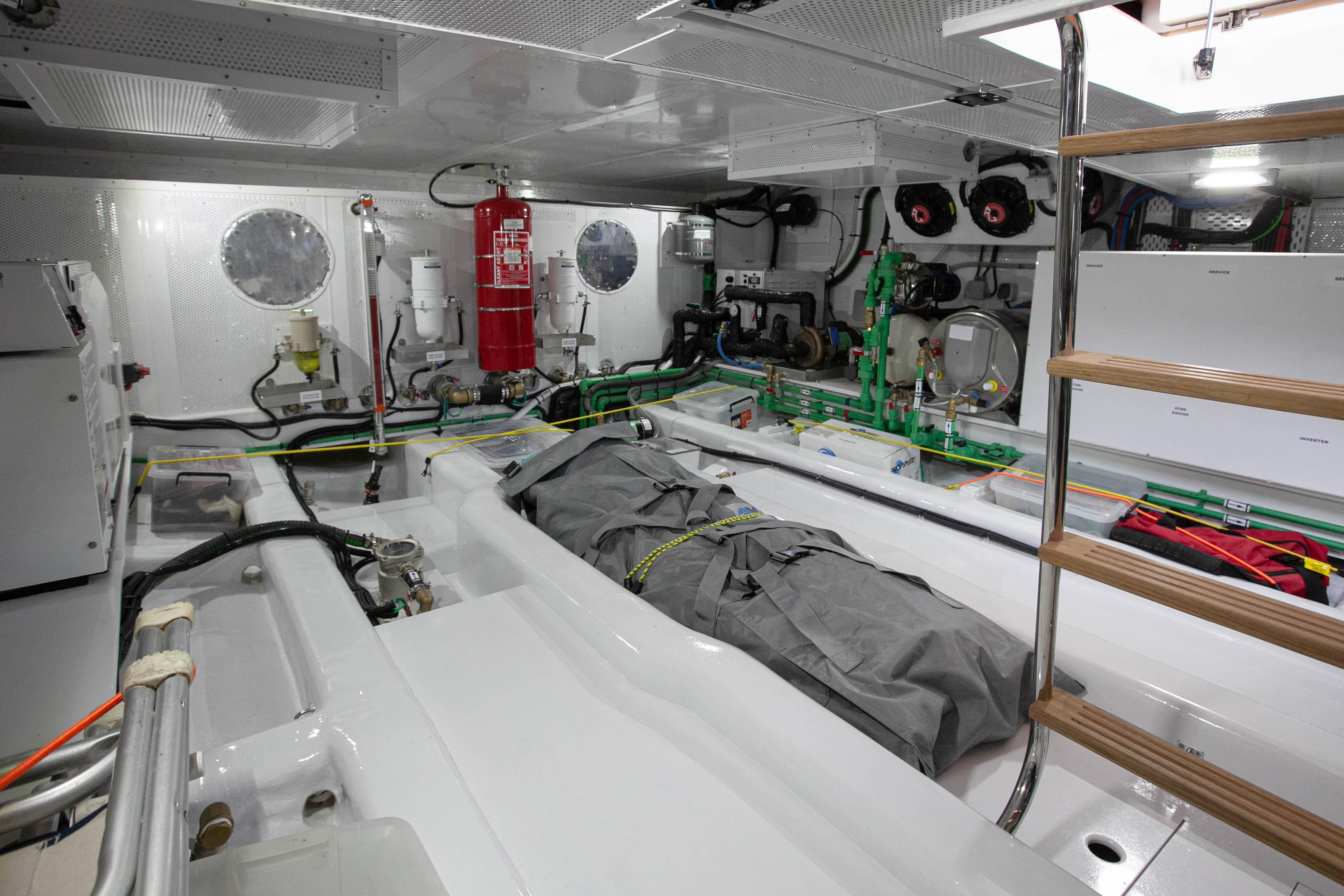 Engine room of 2023 Vicem 55 yacht, featuring modern equipment and safety gear.