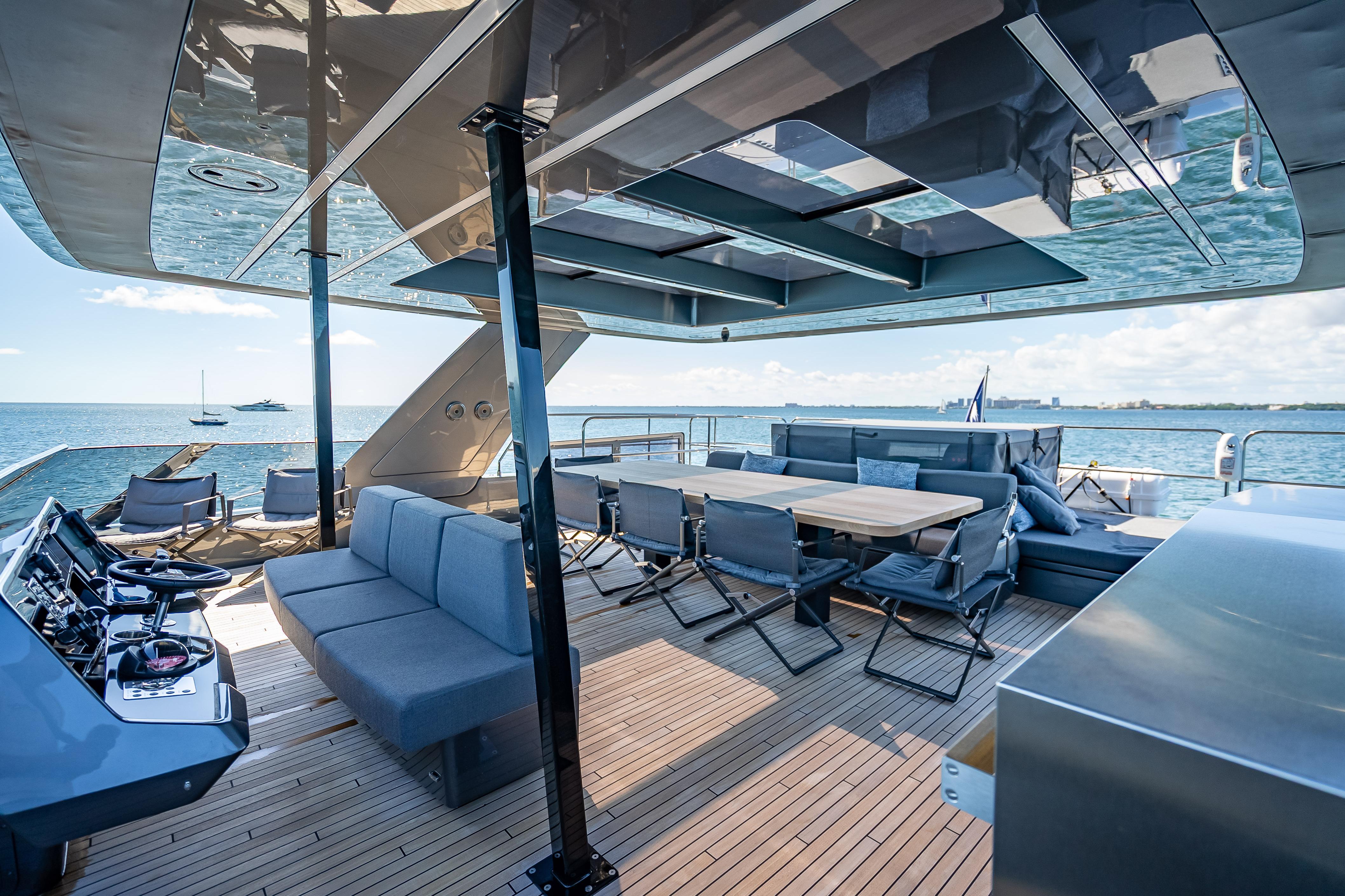 Luxurious Sunreef 60 Power yacht deck with seating, dining area, and ocean view, 2026 model.