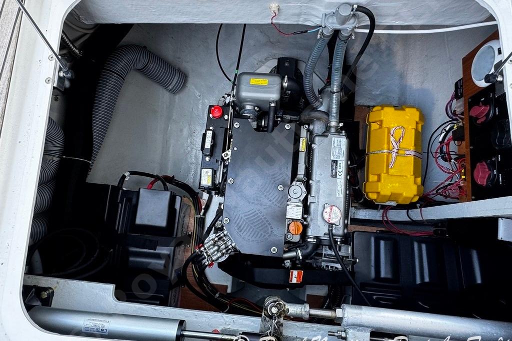 Engine compartment of a 2018 Lagoon 42 catamaran, showcasing mechanical components and wiring.