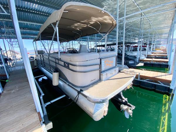 2011 Premier 275 Grand Majestic PTX under a covered dock.