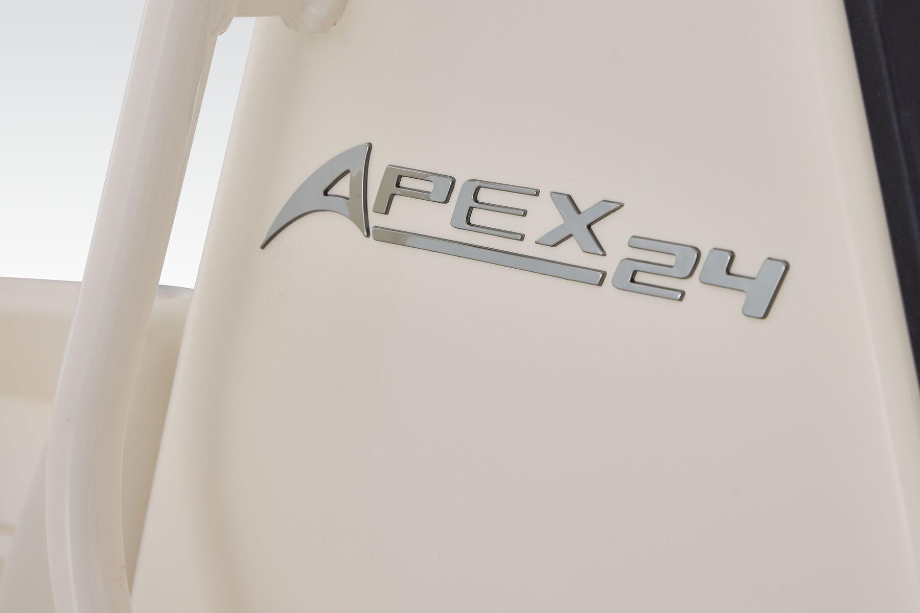 2026 Mako 24 APEX boat logo on a sleek white surface.